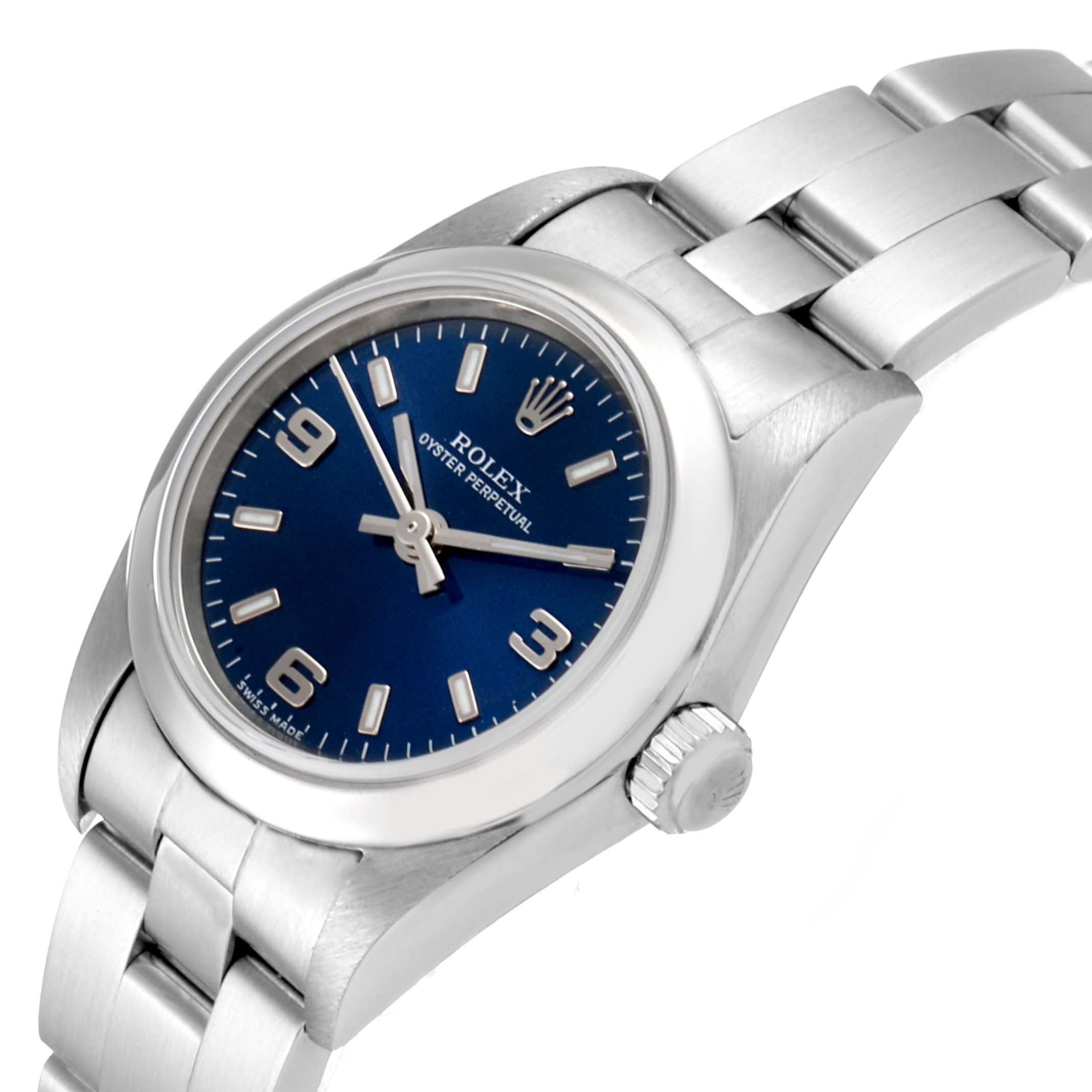The image shows a Rolex Oyster Perpetual 76080 Women
s Stainless Steel Blue Dial 76080 Women
s Stainless Steel Blue Dial watch at a slight angle, highlighting the blue dial, silver bracelet, and crown.