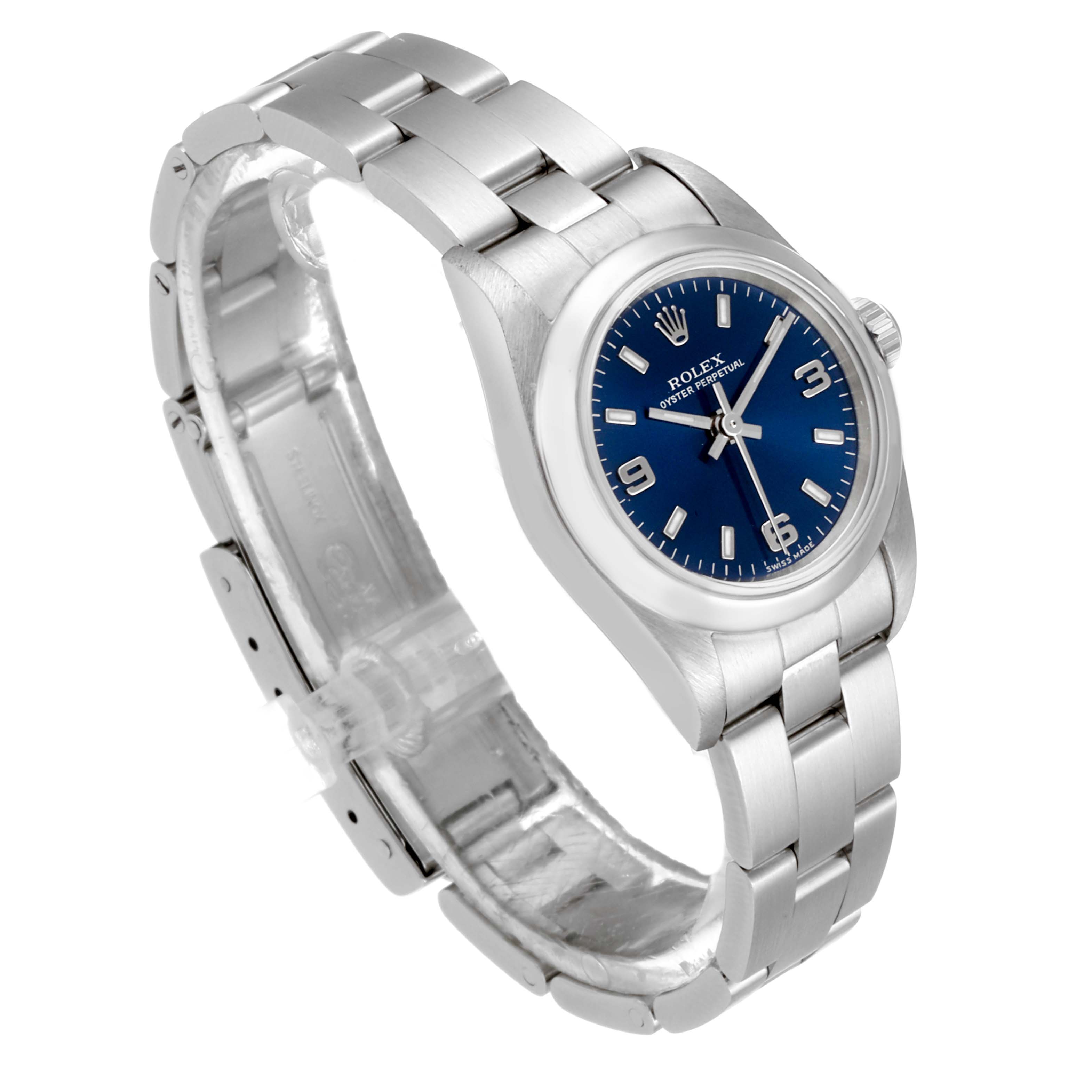 This image shows a Rolex Oyster Perpetual 76080 Women
s Stainless Steel Blue Dial 76080 Women
s Stainless Steel Blue Dial watch from an angled view, highlighting the blue dial, bezel, bracelet, and clasp.