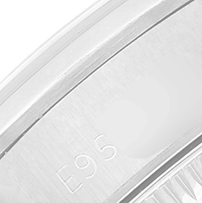 This image shows a close-up of the engraved serial number on the side of the casing of a Rolex Oyster Perpetual 67180 Women
s Stainless Steel Blue Dial 67180 Women
s Stainless Steel Blue Dial watch.