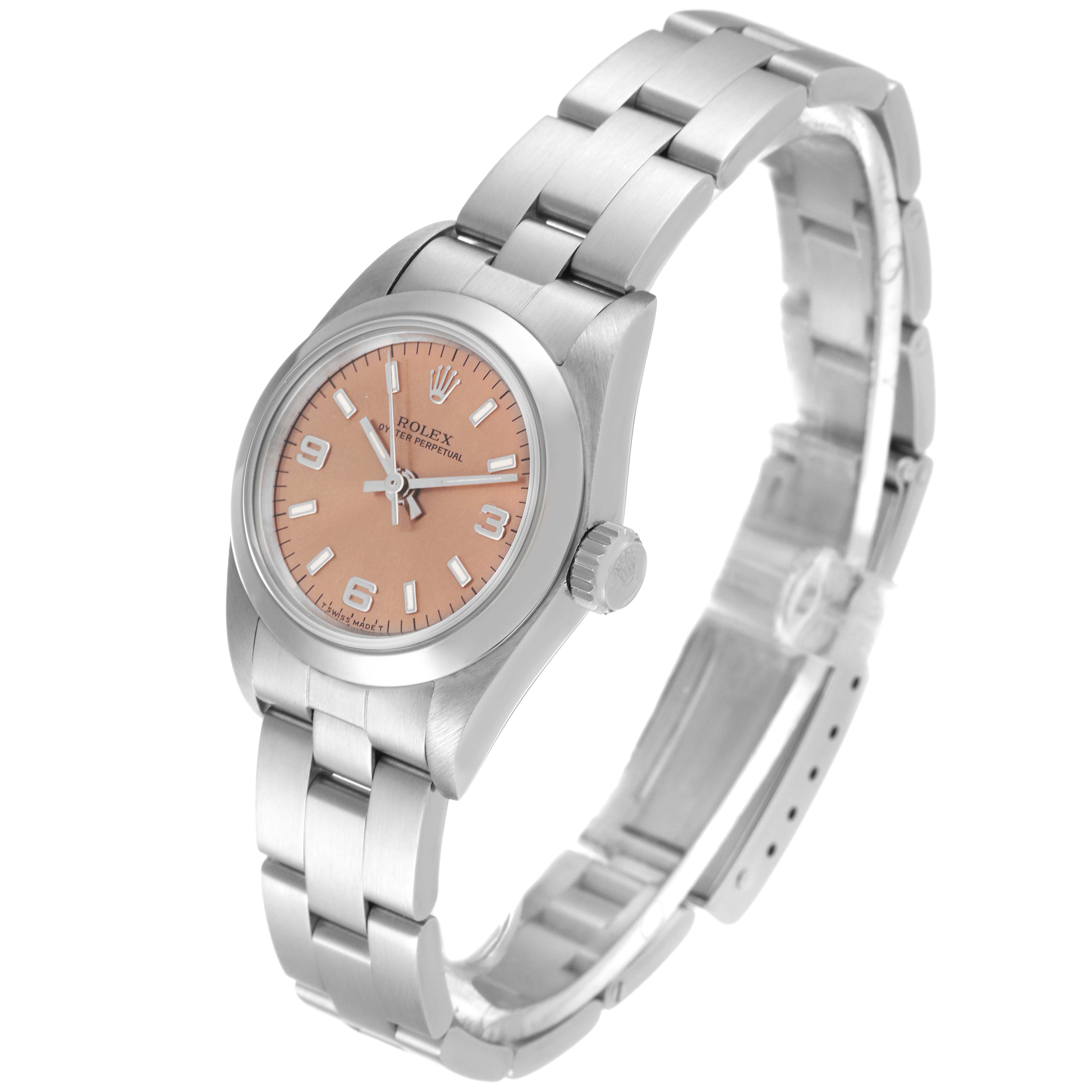 The image shows a Rolex Oyster Perpetual 67180 Women
s Stainless Steel Pink Dial 67180 Women
s Stainless Steel Pink Dial watch with a silver bracelet and a pink dial, angled to display the timepiece and bracelet.