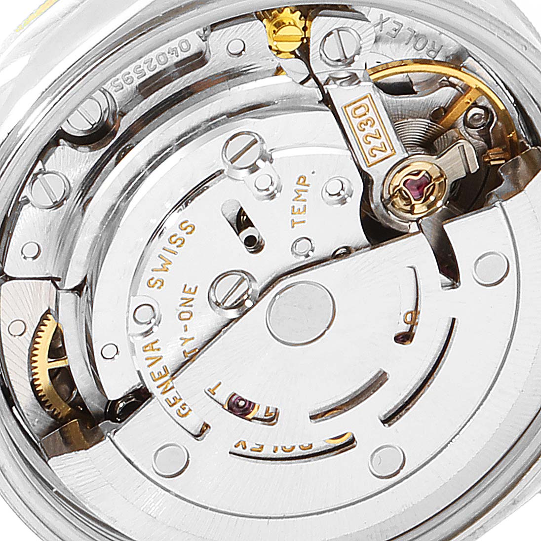 The image shows a close-up view of the movement mechanism of a Rolex Oyster Perpetual 76243 Women's Steel and Gold (two tone) Silver Dial 76243 Women's Steel and Gold (two tone) Silver Dial watch.