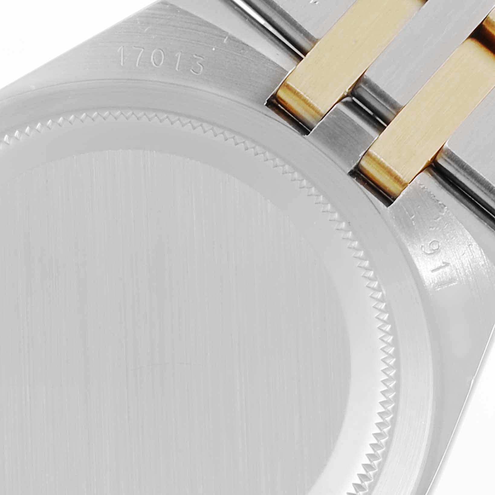 This image shows the case back and part of the bracelet of a Rolex Oysterquartz 17013 Men's Steel and Gold (two tone) Champagne Dial 17013 Men's Steel and Gold (two tone) Champagne Dial watch.