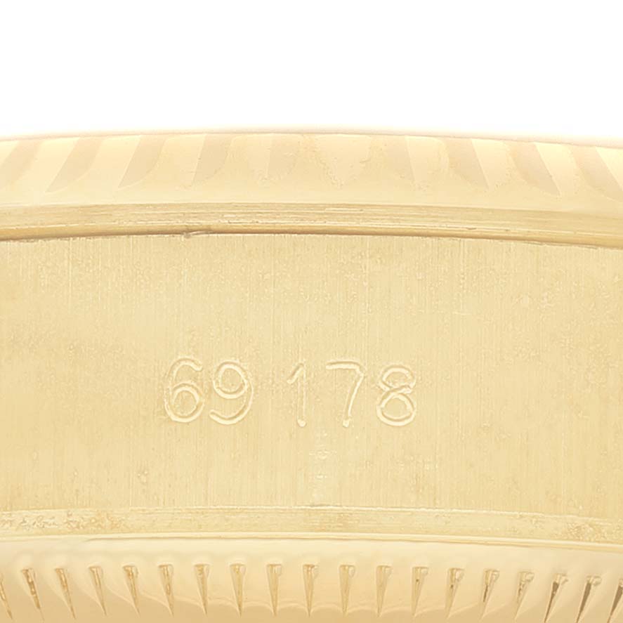 The image shows a close-up of the side of a Rolex President 69178 Women's Yellow Gold Champagne Dial watch with the model number 69178 engraved.