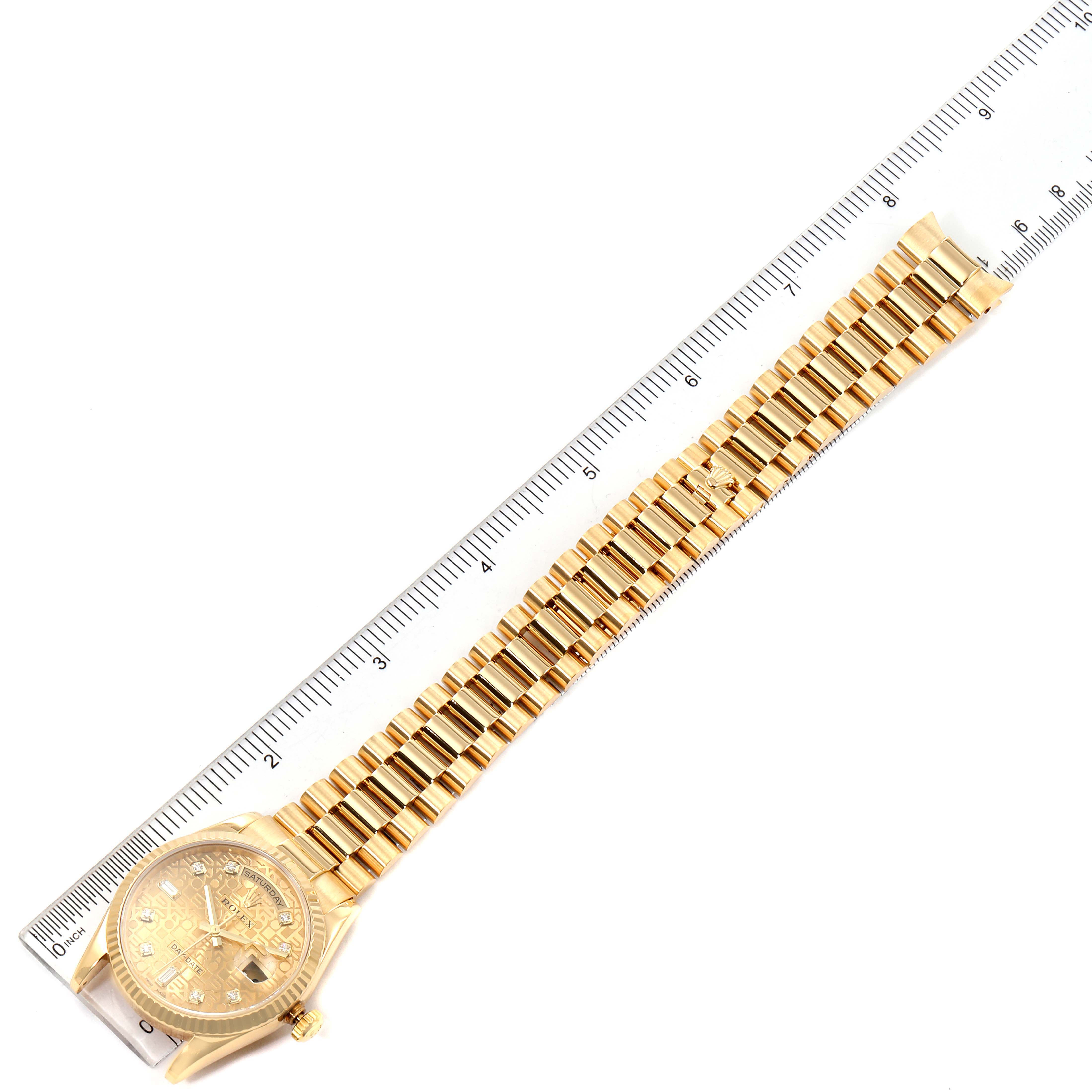 The image shows a top-down view of the Rolex President 118238 Men
s Yellow Gold Champagne Dial 118238 Men
s Yellow Gold Champagne Dial watch, including its bracelet and clasp, alongside a ruler for size reference.