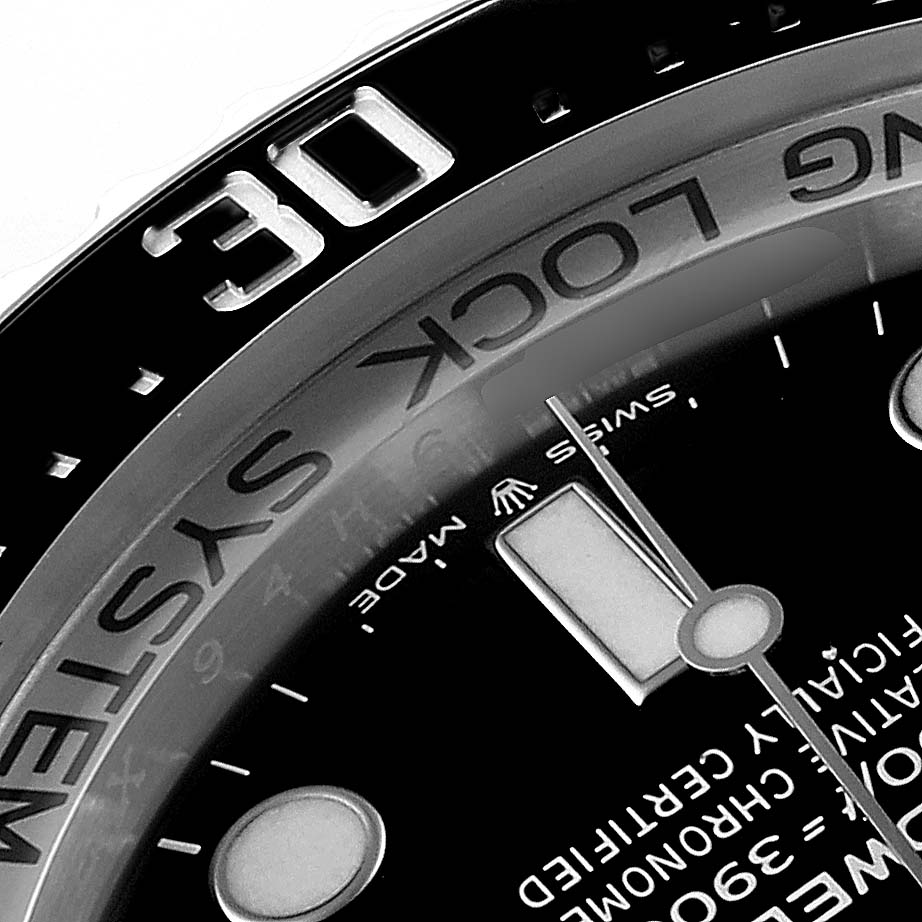 The image shows a close-up of the bezel, minute hand, and part of the dial of a Rolex Sea-Dweller 126660 Men
s Stainless Steel Black Dial 126660 Men
s Stainless Steel Black Dial watch, focusing on the 30-minute mark.