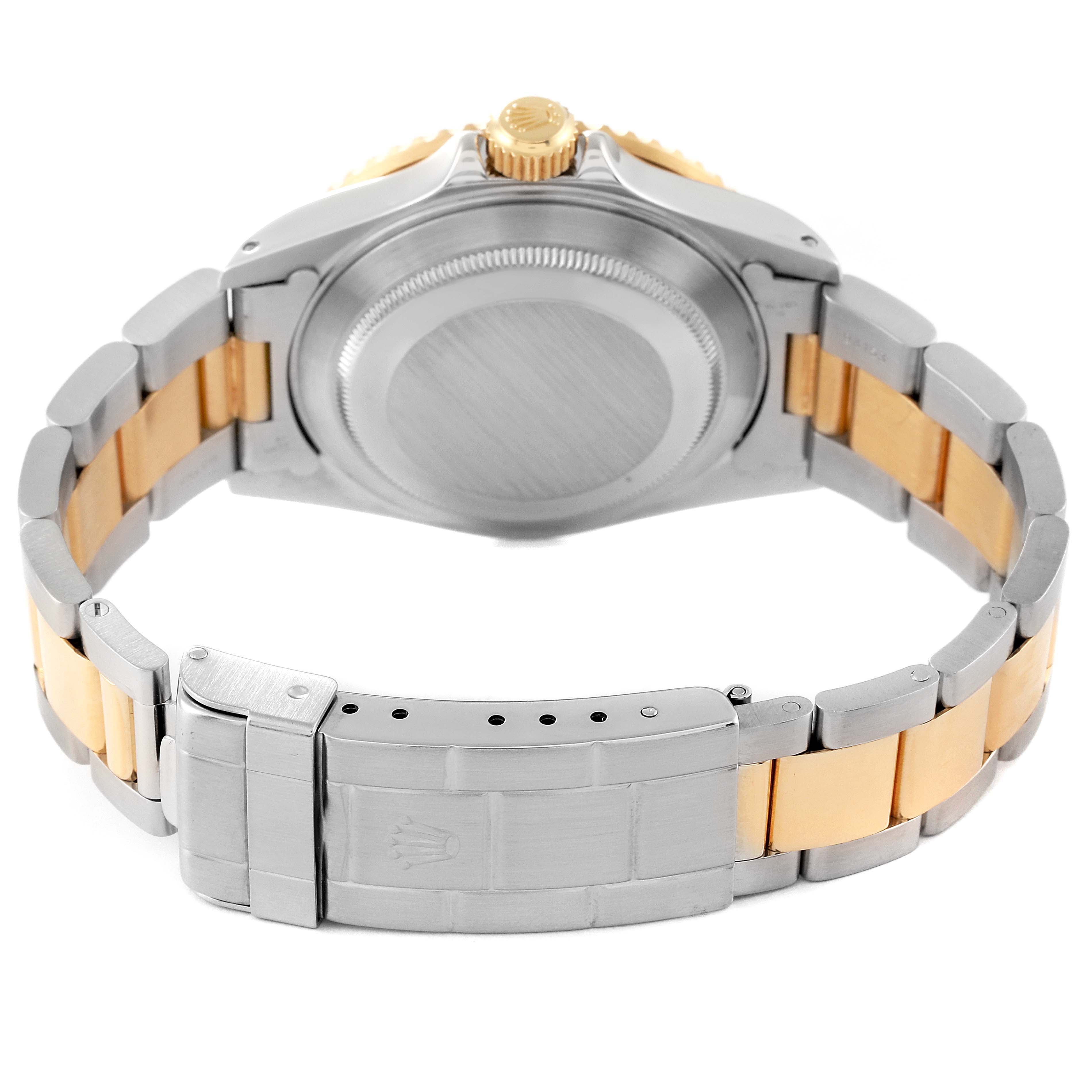 The image shows the back view of the Rolex Submariner 16613 Men
s Steel and Gold (two tone) Blue Dial 16613 Men
s Steel and Gold (two tone) Blue Dial watch, focusing on the case back and two-tone bracelet with the clasp.