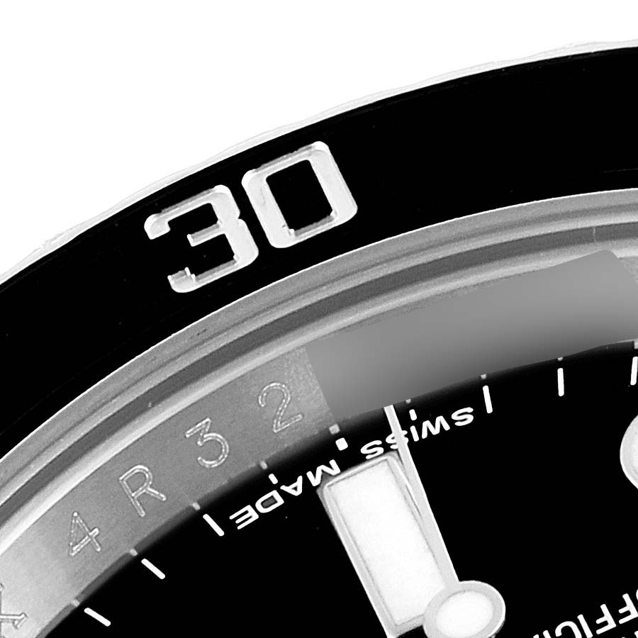 This close-up image shows the bezel, part of the dial, and the "Swiss Made" text on a Rolex Submariner 116610LN Men
s Stainless Steel Black Dial 116610LN Men
s Stainless Steel Black Dial watch.