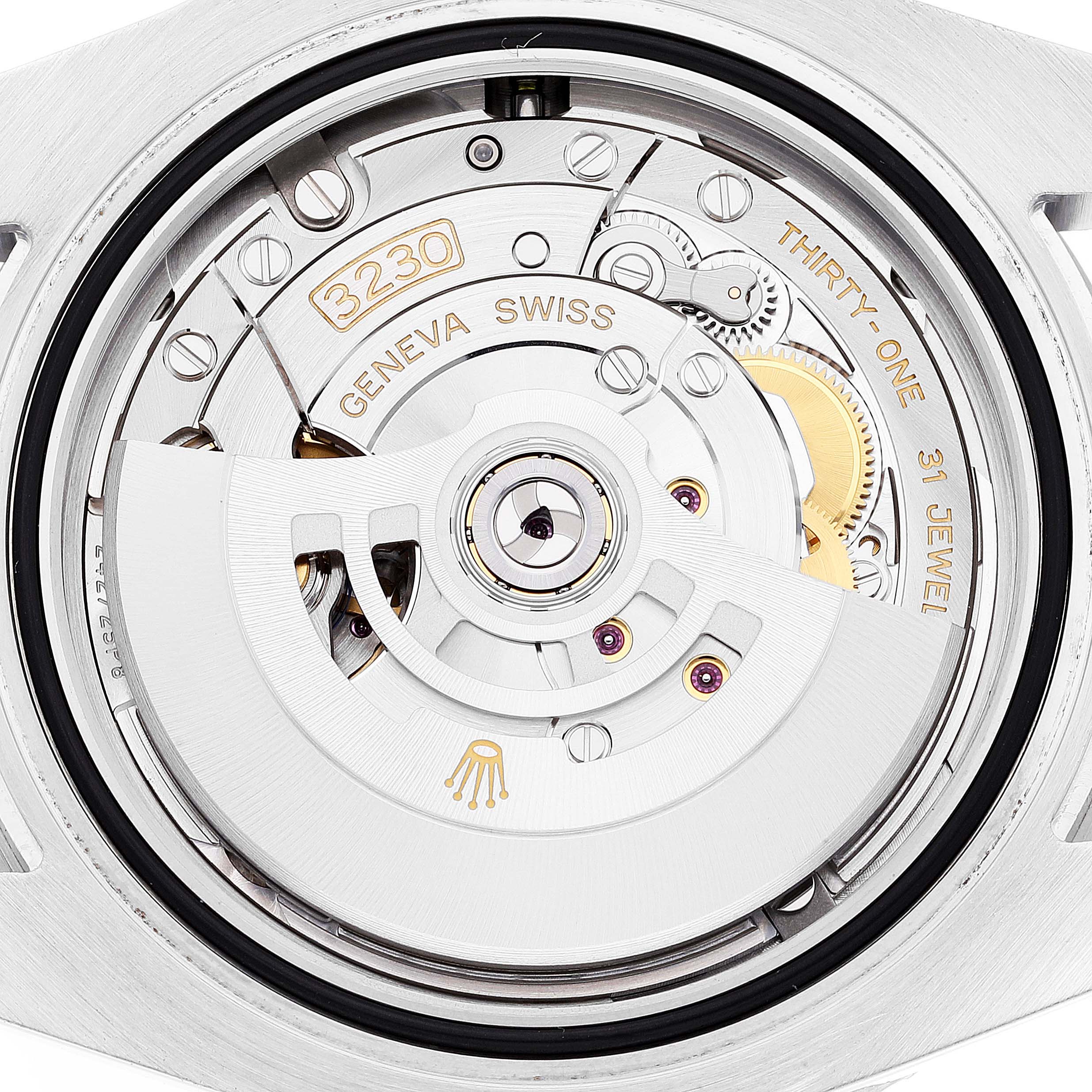 This is a close-up view of the movement mechanism inside a Rolex Submariner 124060 Men's Stainless Steel Black Dial 124060 Men's Stainless Steel Black Dial watch, showing the intricate components and engraving.