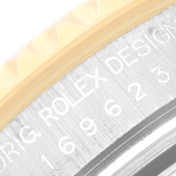 The image shows a close-up of the outer edge and part of the bezel and case of the Rolex Yacht-Master 169623 Women's Steel and Gold (two tone) White Dial 169623 Women's Steel and Gold (two tone) White Dial watch with engraved text.