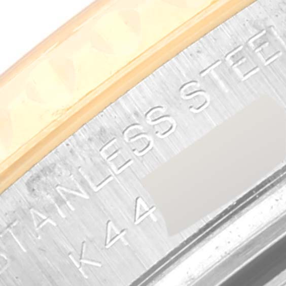 The image shows a close-up of the bezel and part of the casing with engravings from a Rolex Yacht-Master 169623 Women's Steel and Gold (two tone) White Dial 169623 Women's Steel and Gold (two tone) White Dial watch.