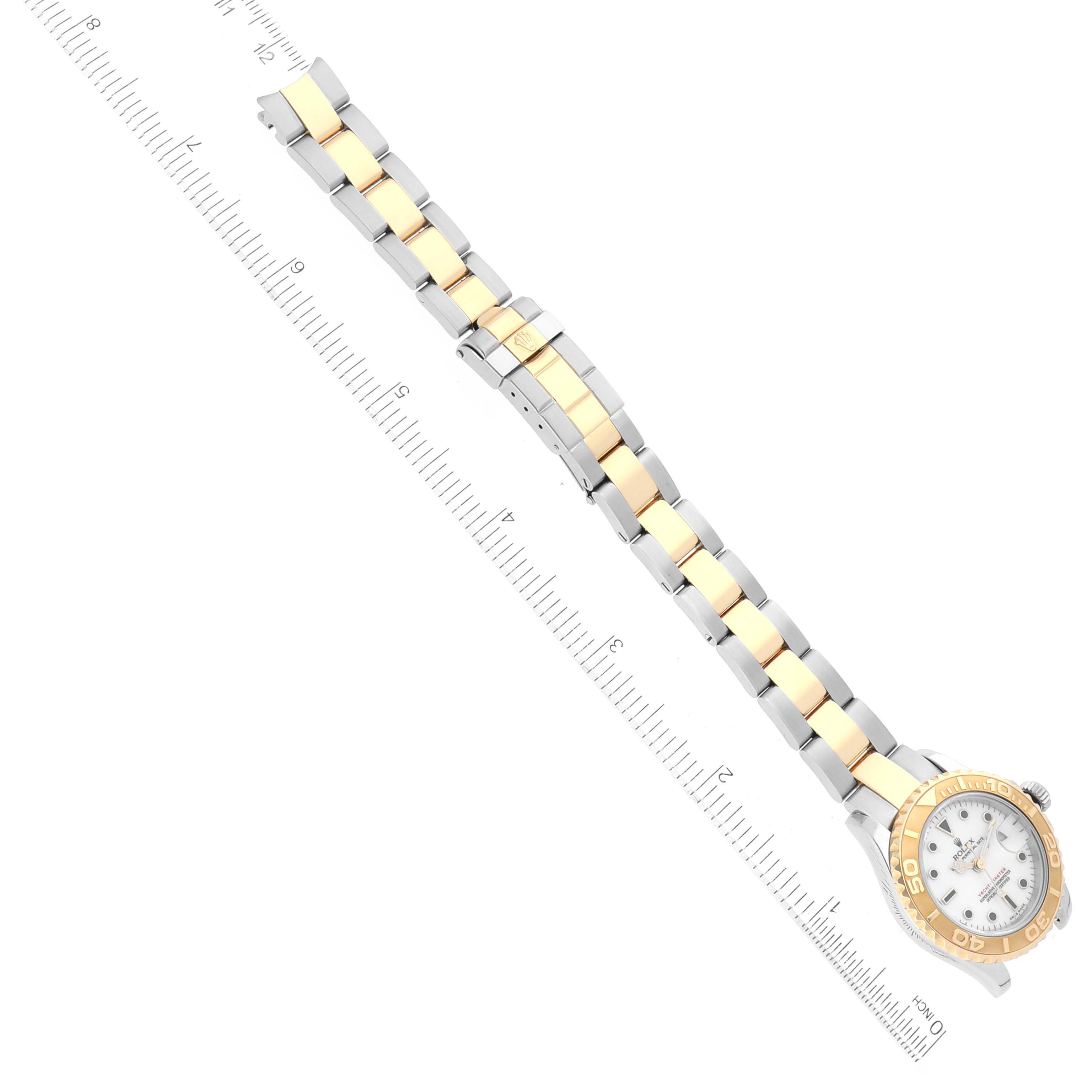 This image shows a top view of a Rolex Yacht-Master 169623 Women's Steel and Gold (two tone) White Dial 169623 Women's Steel and Gold (two tone) White Dial watch, highlighting its two-tone metal bracelet and ruler for scale.