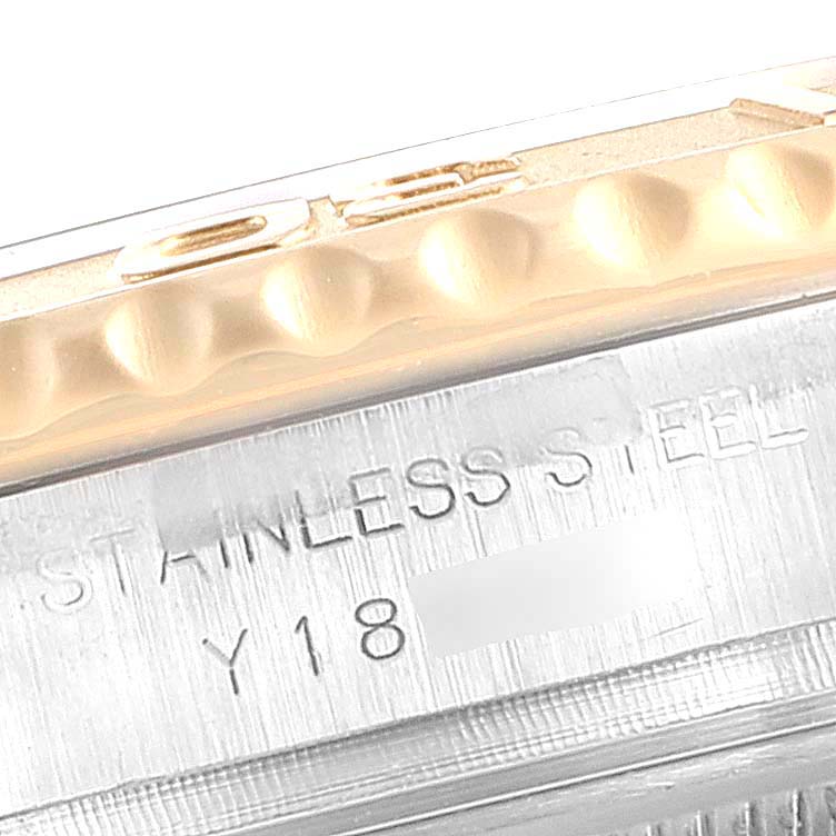 This close-up image of a Rolex Yacht-Master 169623 Women's Steel and Gold (two tone) White Dial 169623 Women's Steel and Gold (two tone) White Dial watch shows the stainless steel case and part of the fluted bezel.