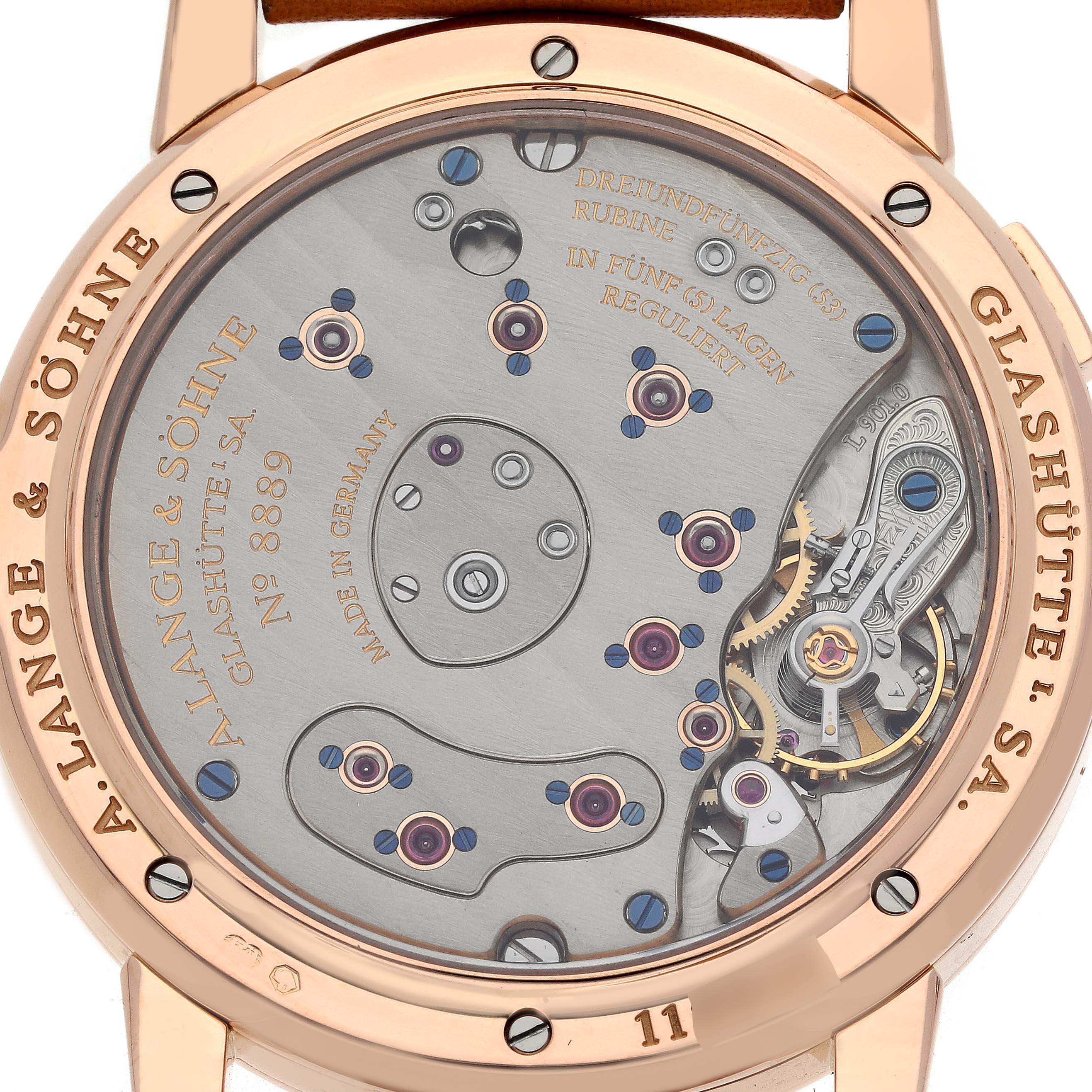 The image shows the back view of the Lange 1 by A. Lange & Söhne, highlighting its movement and inner mechanisms.