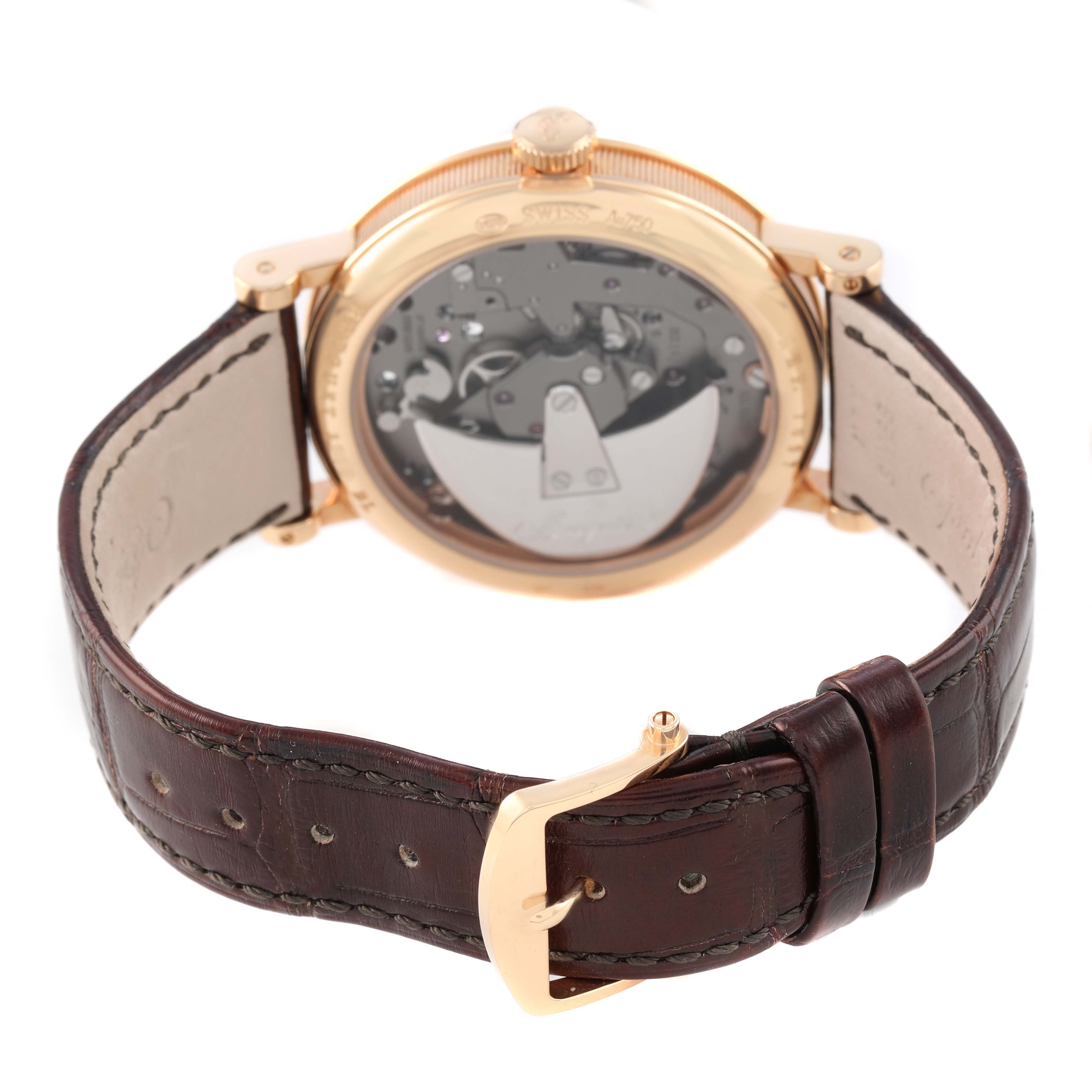 The Breguet Tradition G7097BR/G1/9WU Men's Rose Gold Silver Dial watch is shown from the back, displaying its open caseback and brown leather strap.