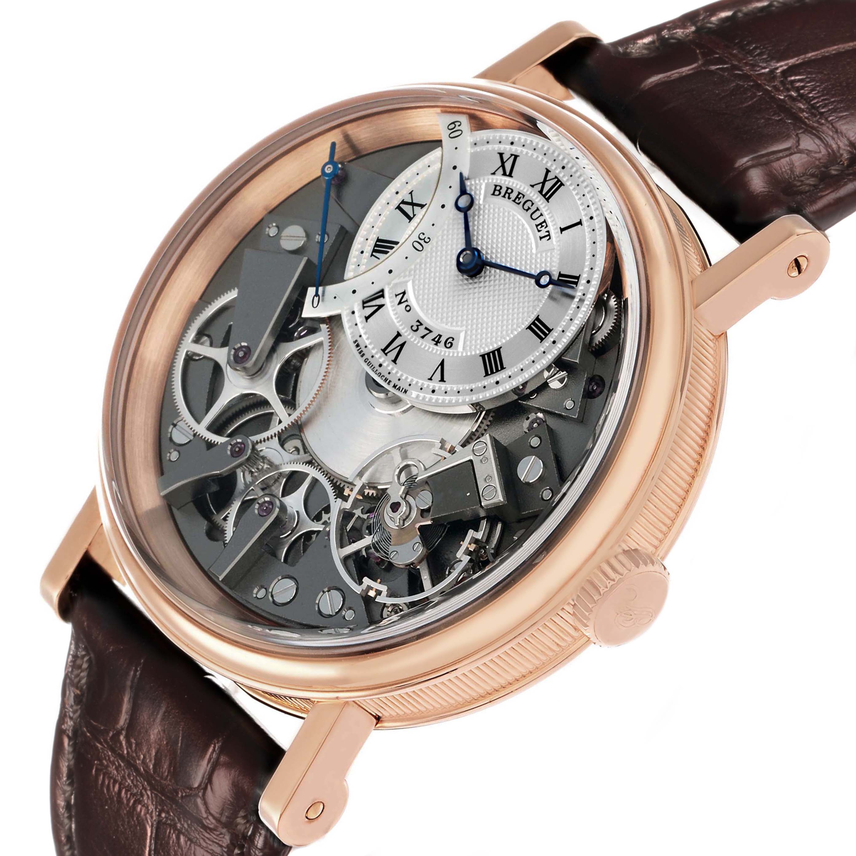 The Breguet Tradition G7097BR/G1/9WU Men's Rose Gold Silver Dial watch is shown at a slight side angle, highlighting its intricate movement and dial.