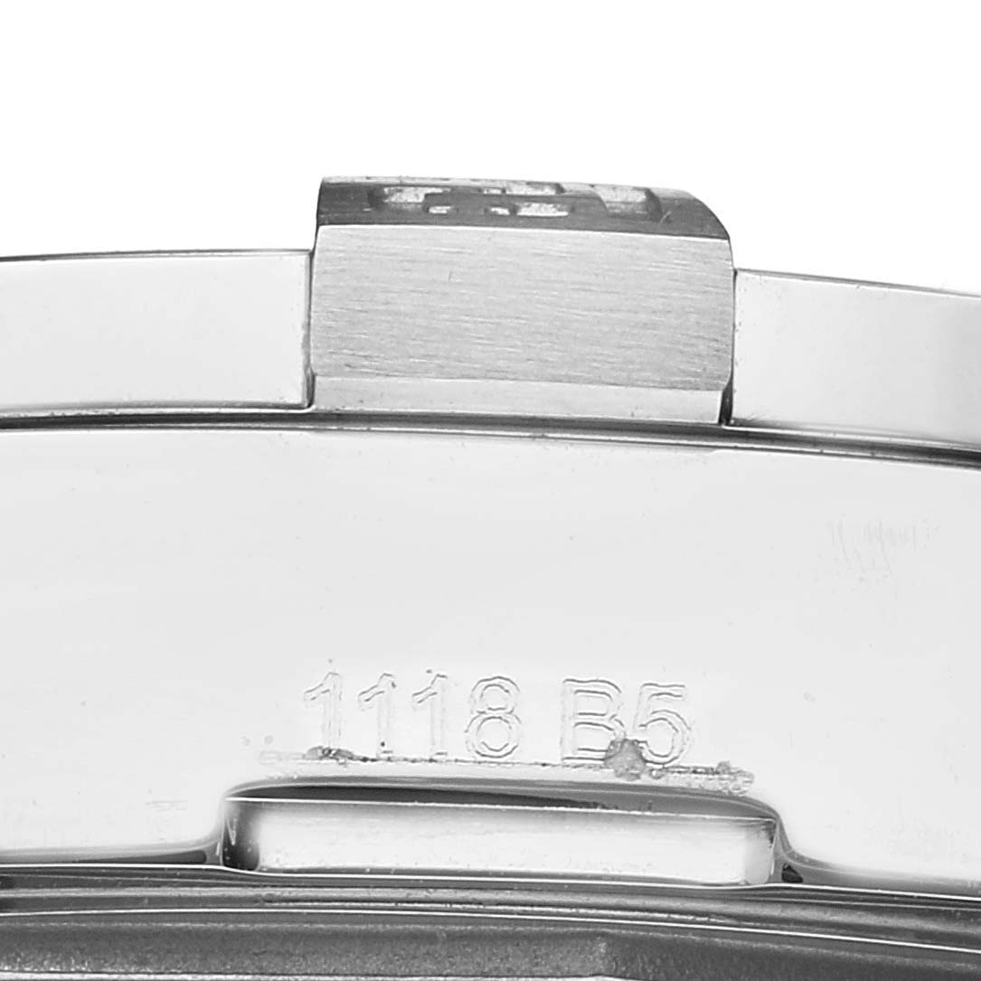 This image shows a close-up view of the clasp and part of the band of a Breitling Avenger A32390 Men's Stainless Steel Mother of Pearl Dial A32390 Men's Stainless Steel Mother of Pearl Dial watch with visible engraved numbers.
