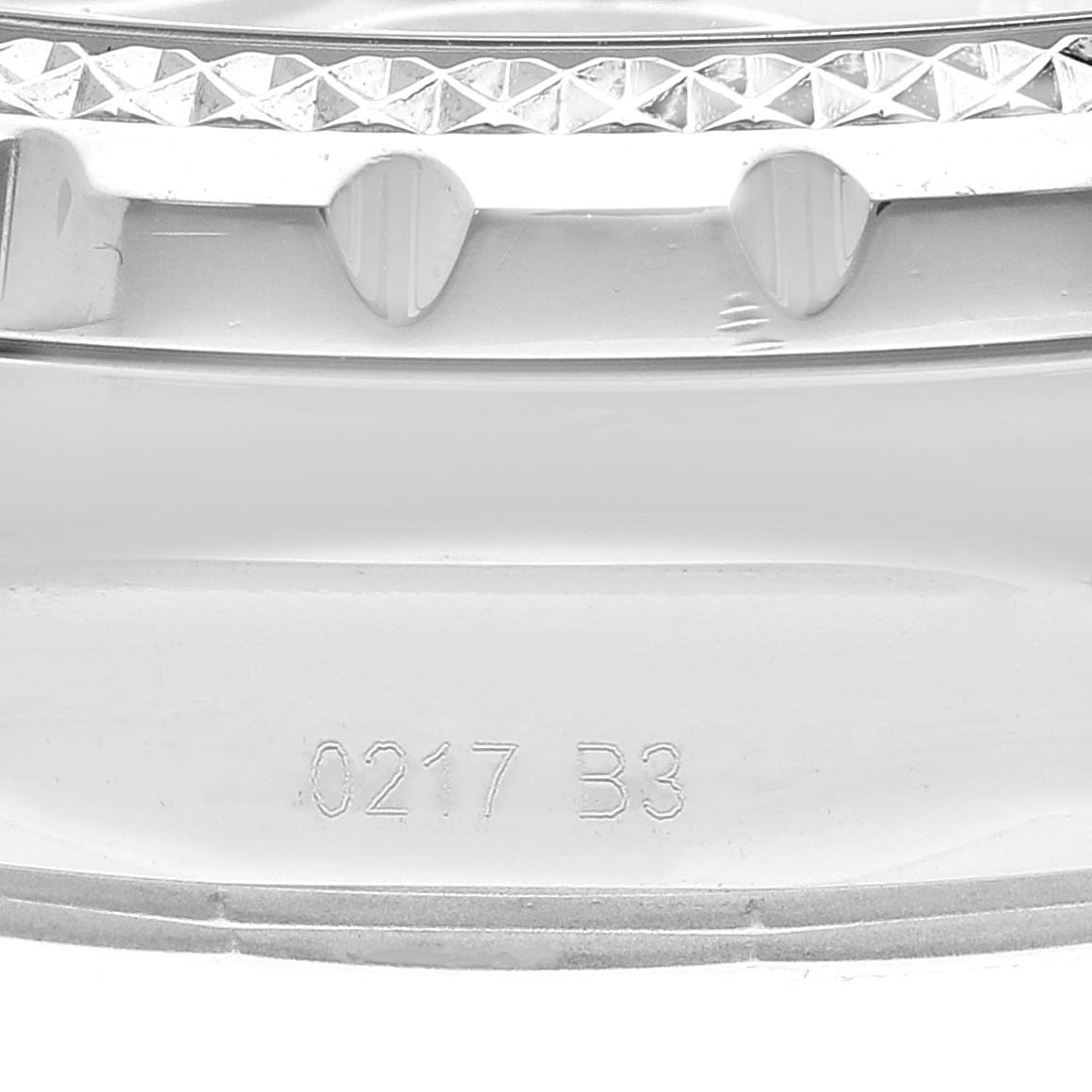 This image shows a close-up of the bezel and serial number engraving on a Bentley model by Breitling.