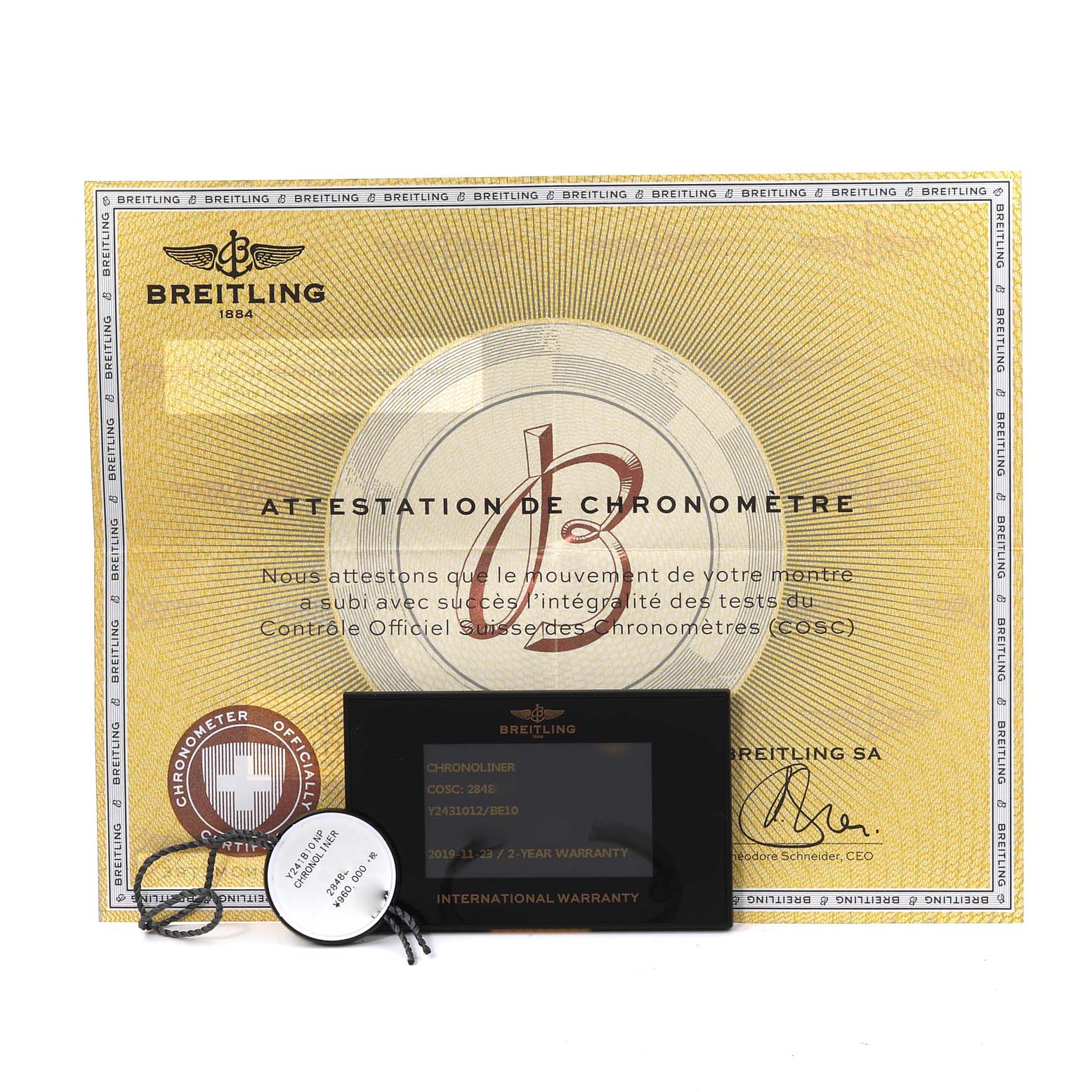The image shows the Breitling Chronoliner Y2431012/BE10 Men's Stainless Steel Black Dial Y2431012/BE10 Men's Stainless Steel Black Dial model's warranty card, tag, and chronometer certificate.