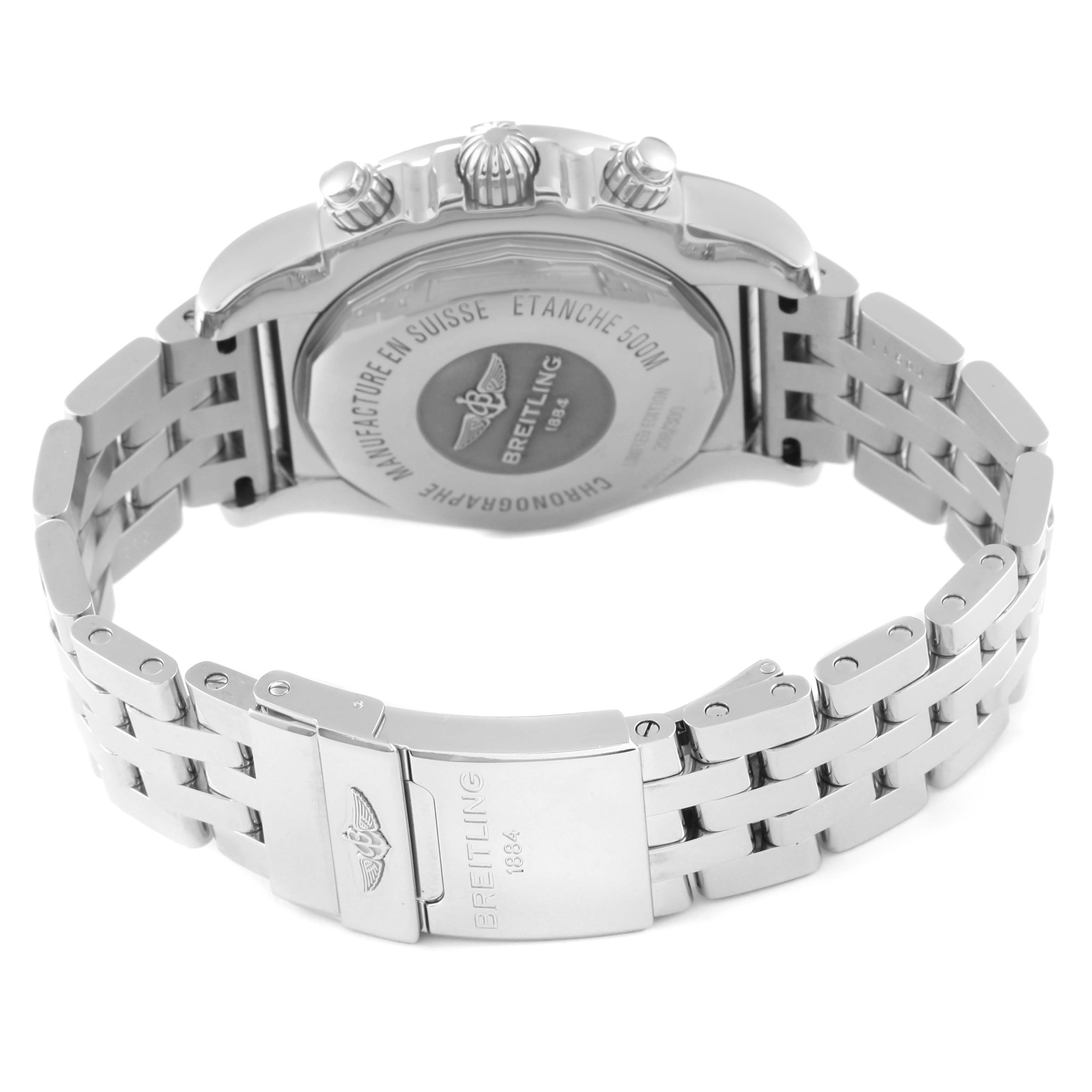 This image shows the back of a Limited Series Breitling watch and its metal bracelet from a slightly overhead angle.