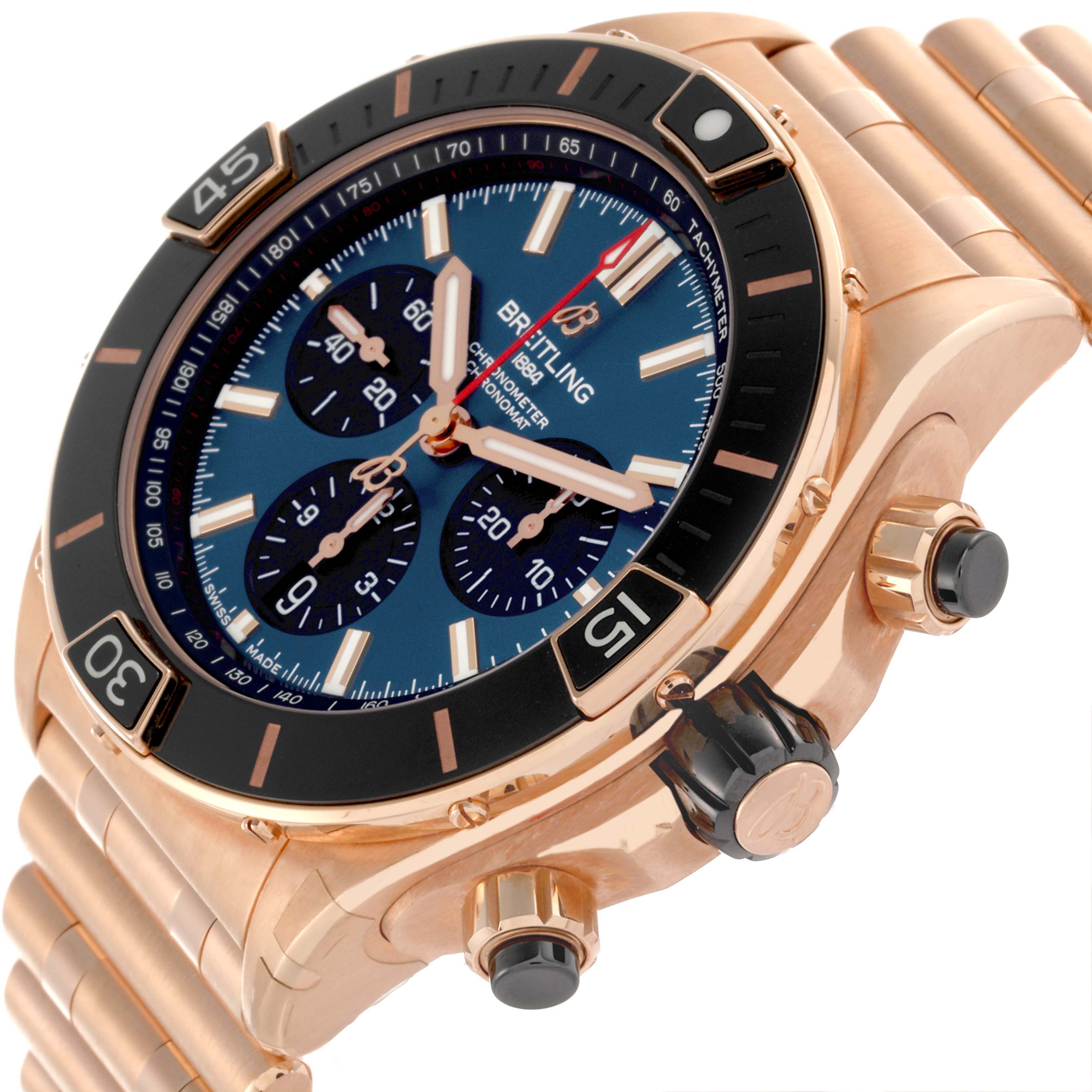 The Breitling Chronomat RB0136 Men's Rose Gold Blue Dial RB0136 Men's Rose Gold Blue Dial watch is shown at an angled close-up, highlighting the dial, bezel, crown, and part of the bracelet.