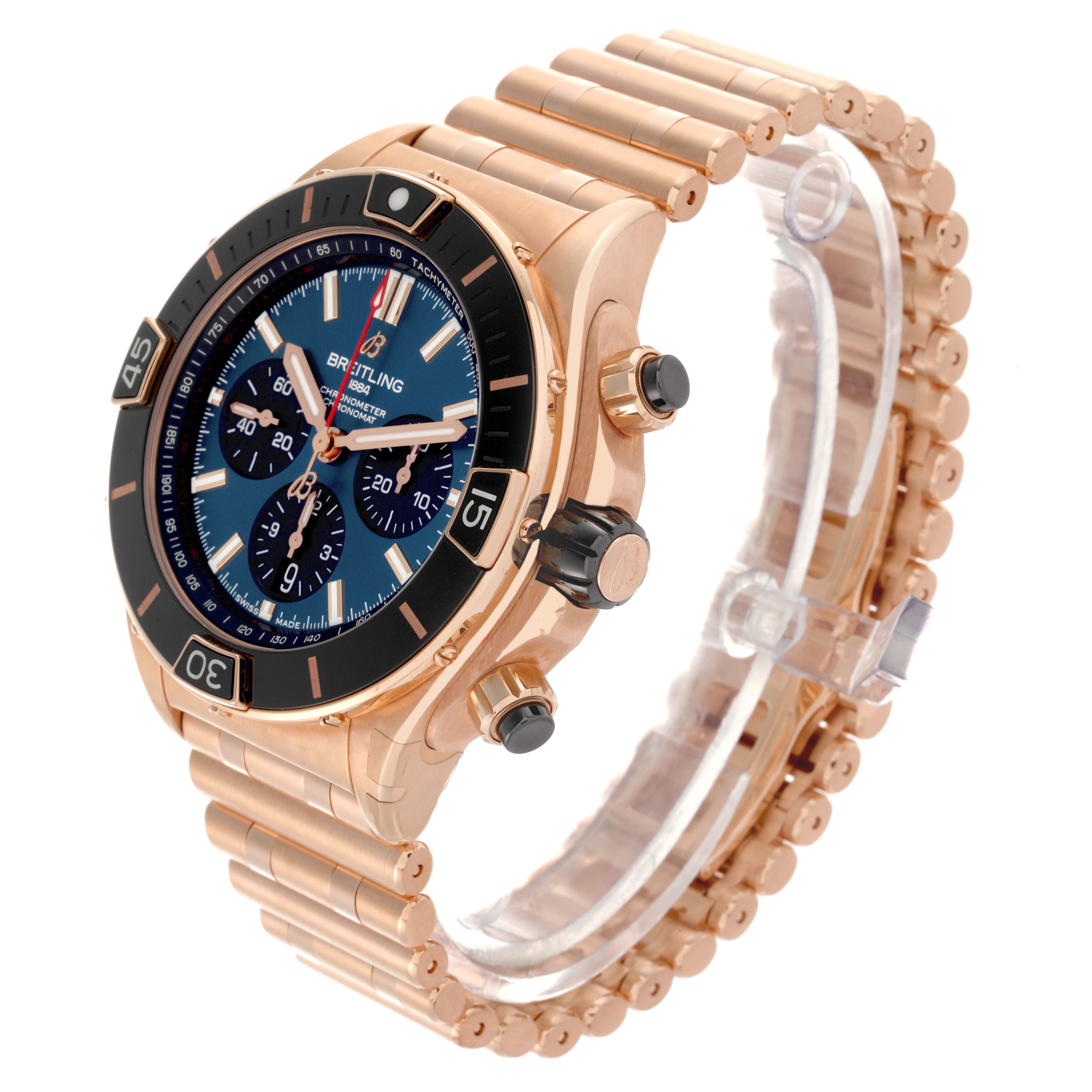 The Breitling Chronomat RB0136 Men's Rose Gold Blue Dial RB0136 Men's Rose Gold Blue Dial watch is shown at a three-quarter angle, highlighting the face, bezel, crown, pushers, and bracelet.