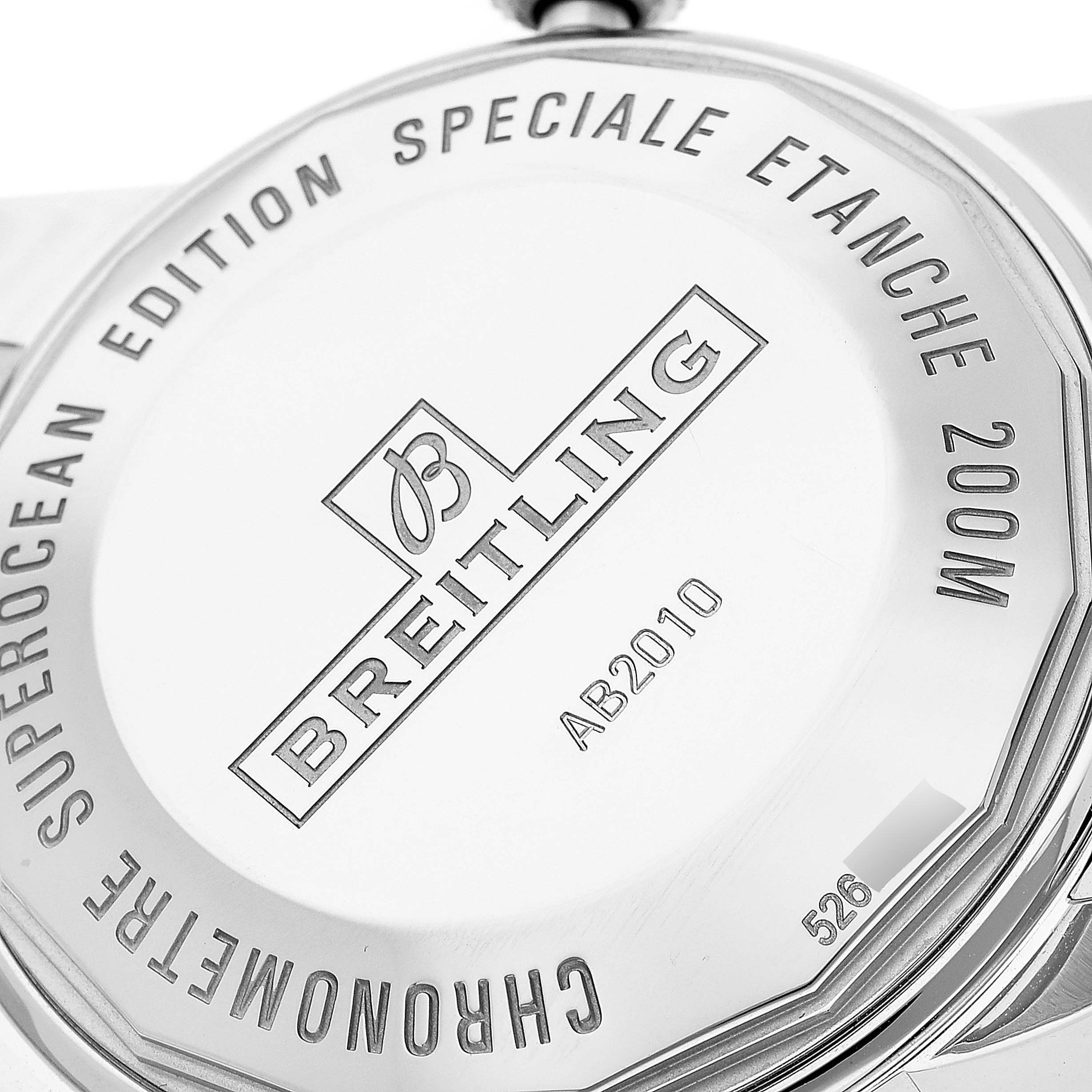 The image shows the back case of a Breitling Superocean AB2010 Men's Stainless Steel Green Dial AB2010 Men's Stainless Steel Green Dial watch, featuring the brand's logo and model specifications.