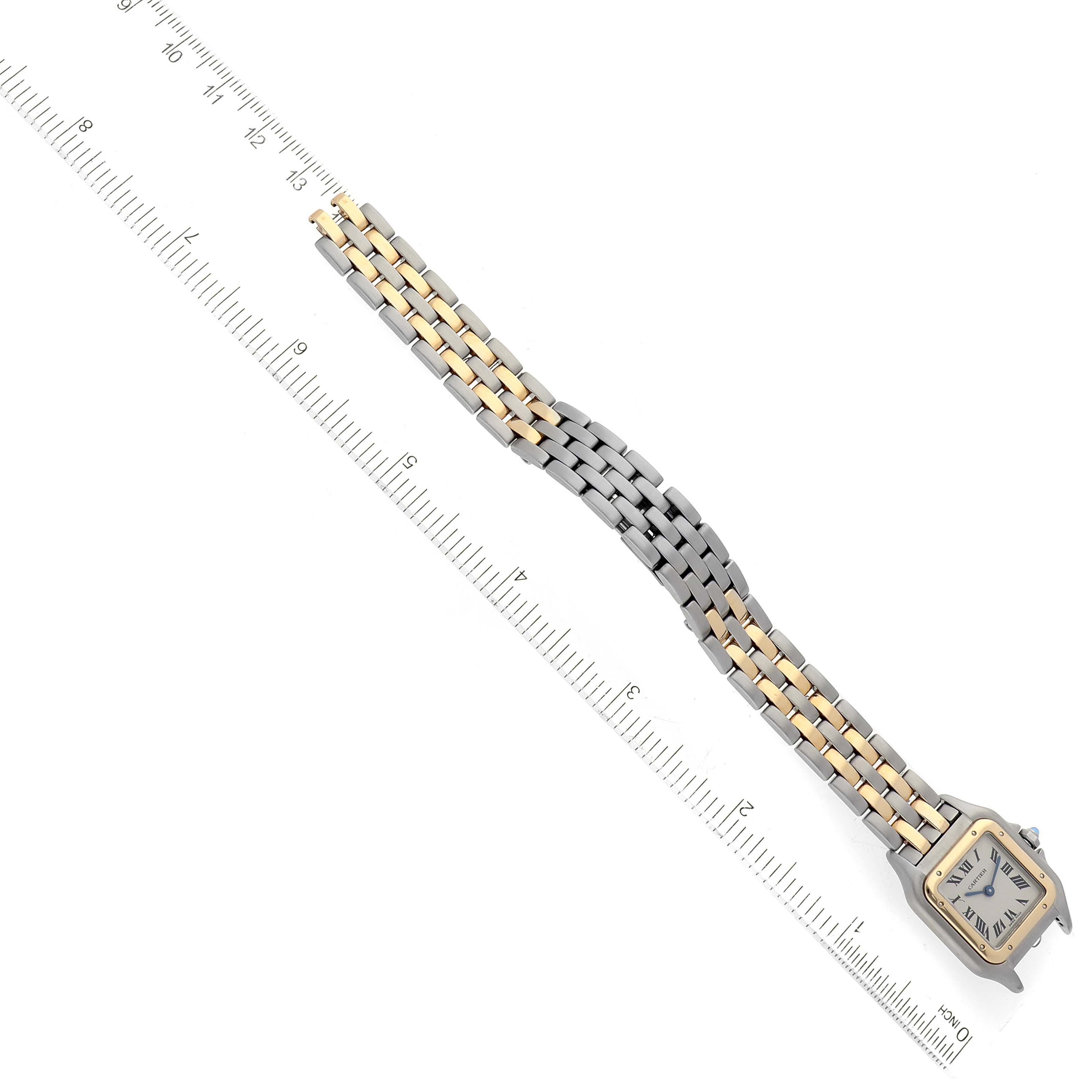The image shows the Cartier Panthere W25029B6 Women's Steel and Gold (two tone) Silver Dial W25029B6 Women's Steel and Gold (two tone) Silver Dial watch laid flat next to a ruler, displaying its rectangular face and two-tone metal bracelet.