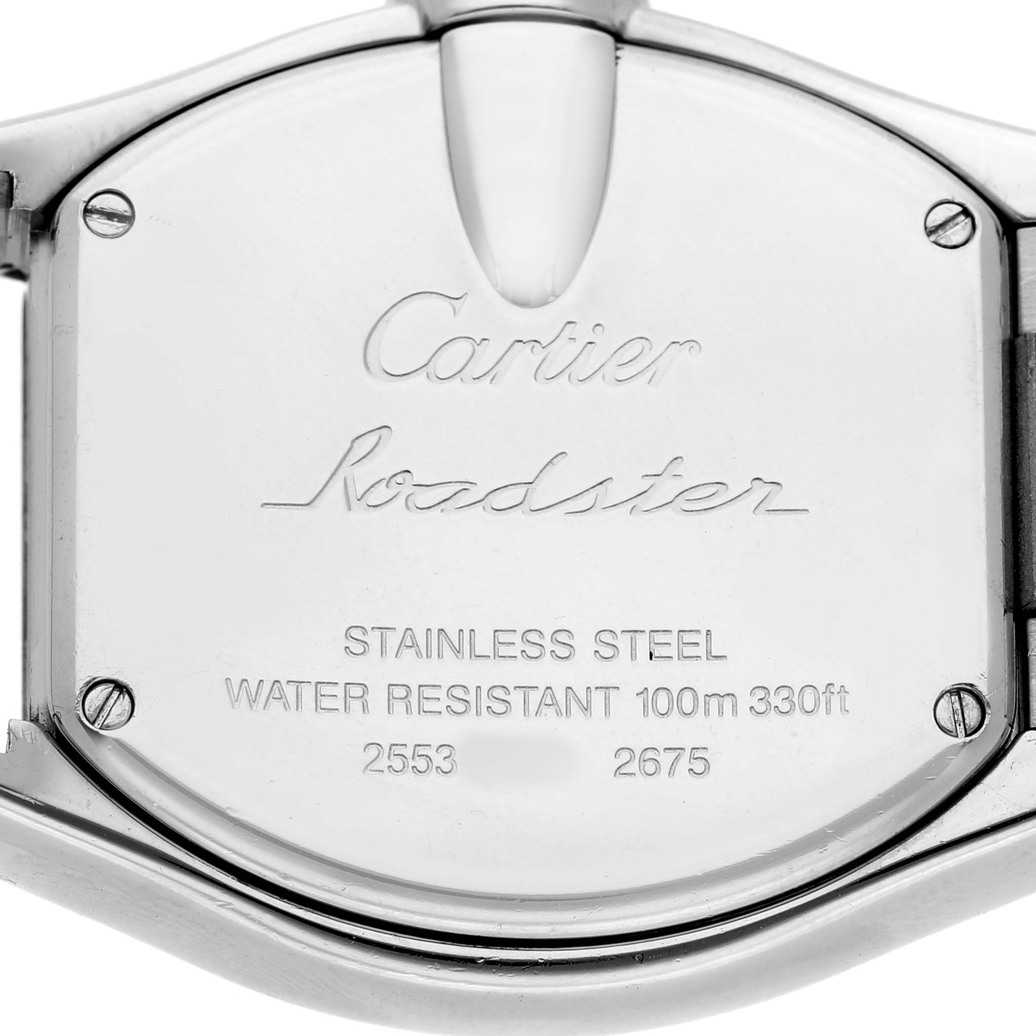 The image shows the back casing of a Cartier Roadster W62017V3 Women's Stainless Steel Pink Dial watch, displaying brand markings and model details.