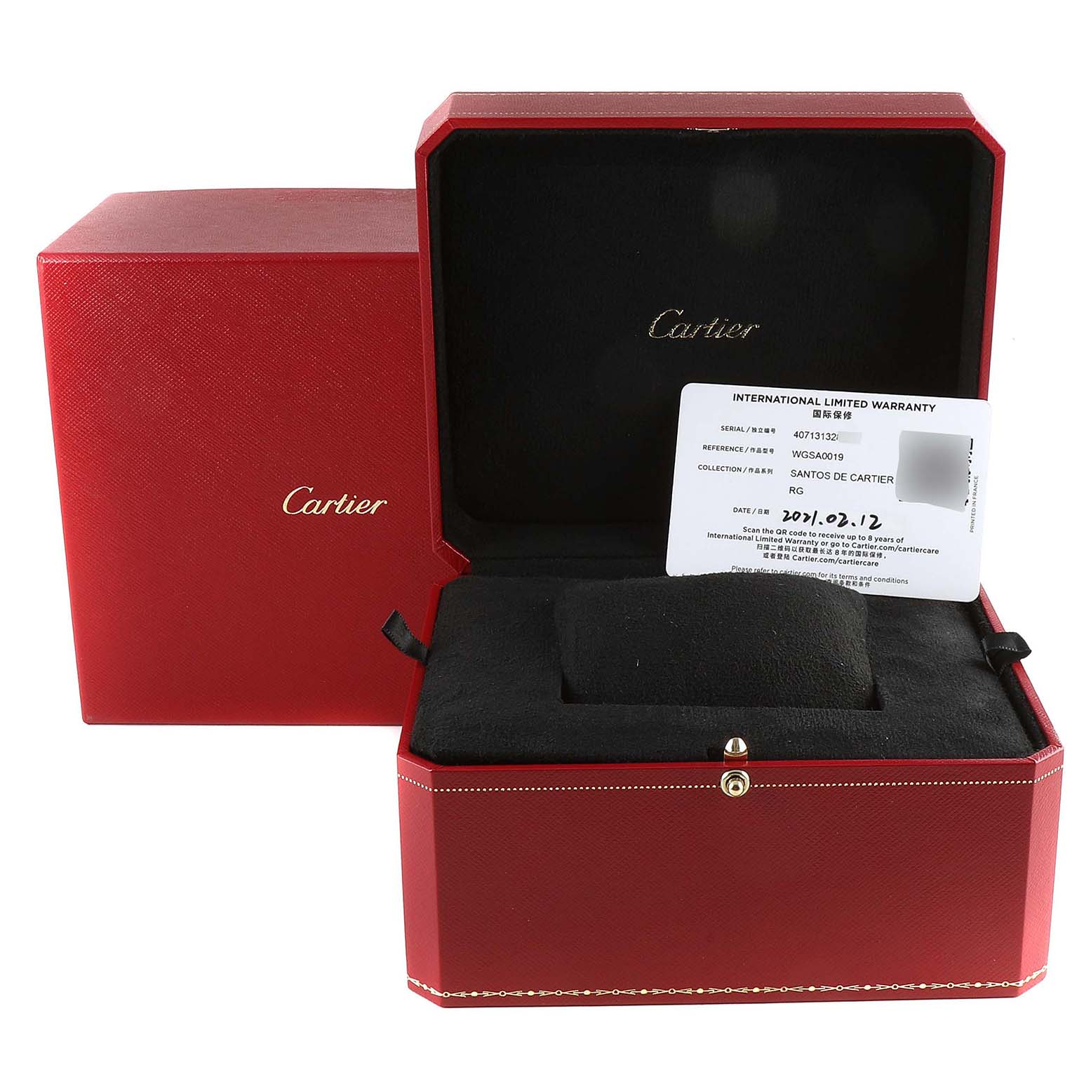 The image shows the packaging, including the red box and international warranty card, for a Santos de Cartier watch.
