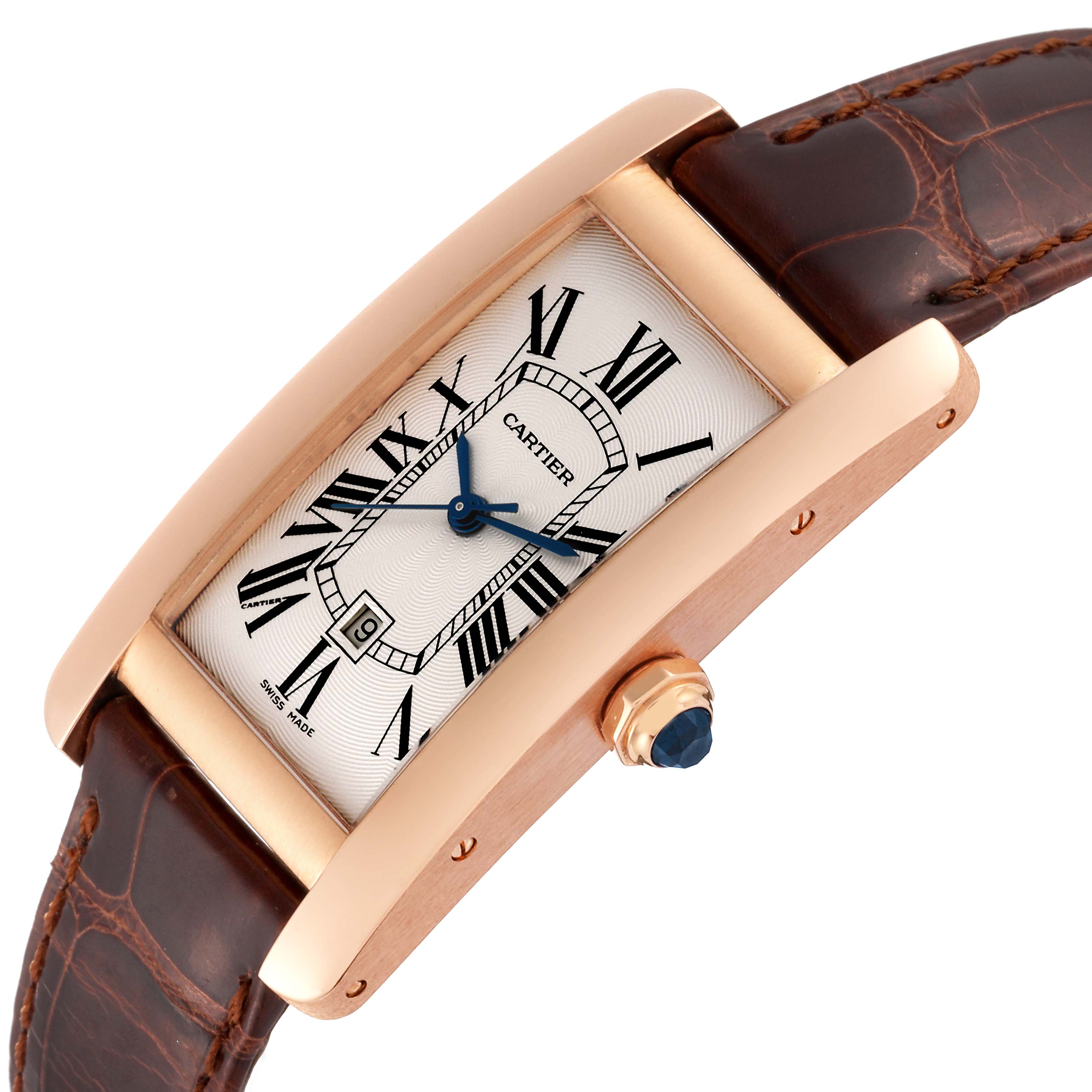 The image shows an angled close-up of the Cartier Tank Americaine W2620030 Women
s Rose Gold Silver Dial W2620030 Women
s Rose Gold Silver Dial watch, highlighting the face, crown, and part of the leather strap.