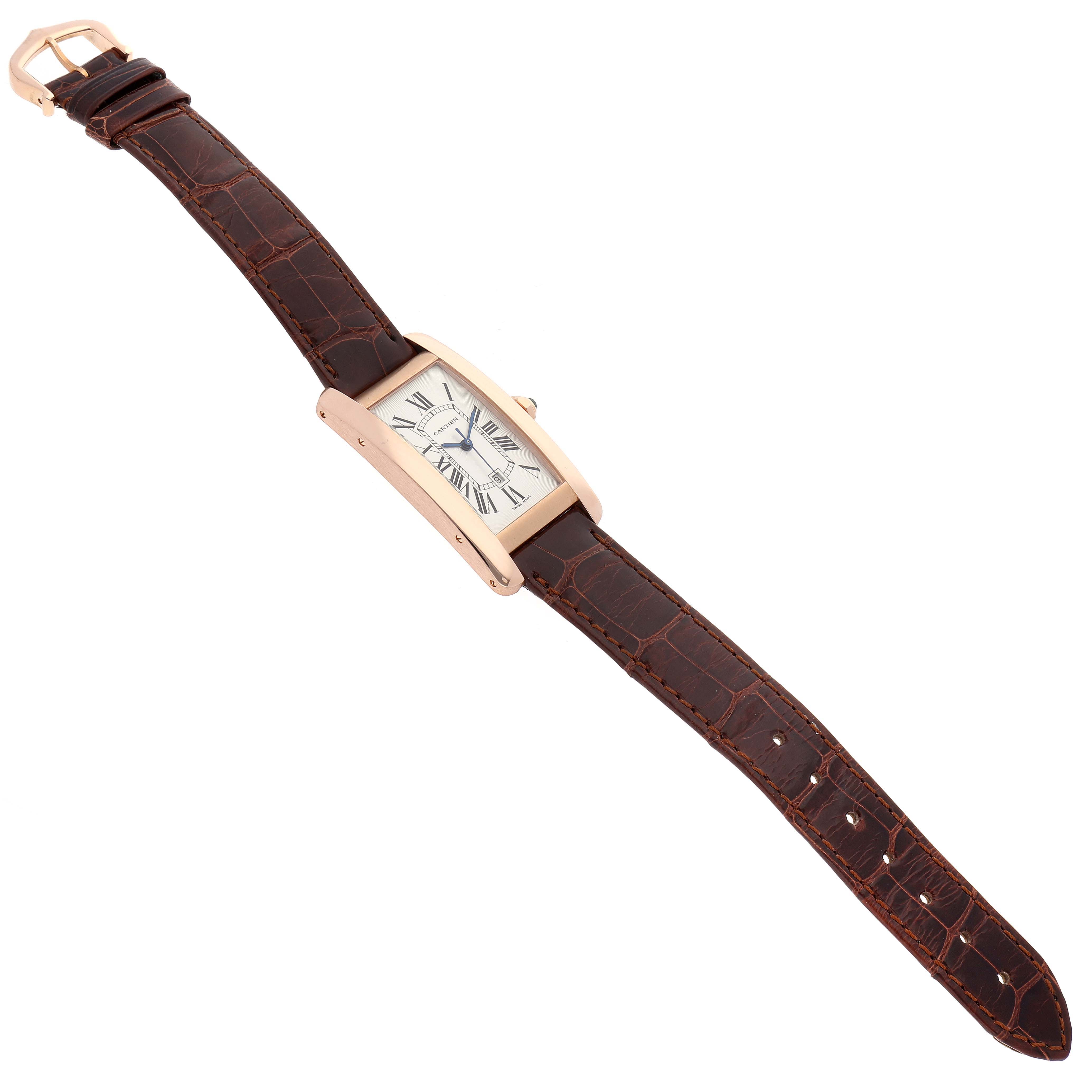 The image shows a top-down view of a Cartier Tank Americaine W2620030 Women
s Rose Gold Silver Dial W2620030 Women
s Rose Gold Silver Dial watch featuring the face, case, and leather strap with buckle.