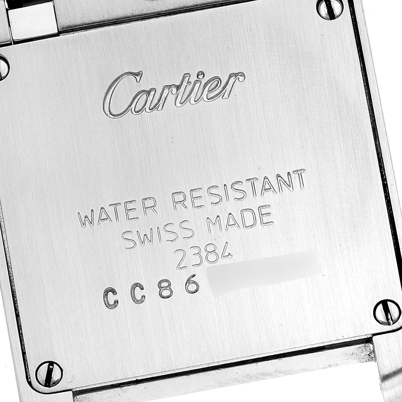 This image shows the back case of a Cartier Tank Francaise W51007Q4 Women's Steel and Gold (two tone) Silver Dial W51007Q4 Women's Steel and Gold (two tone) Silver Dial watch, displaying brand markings and model details.