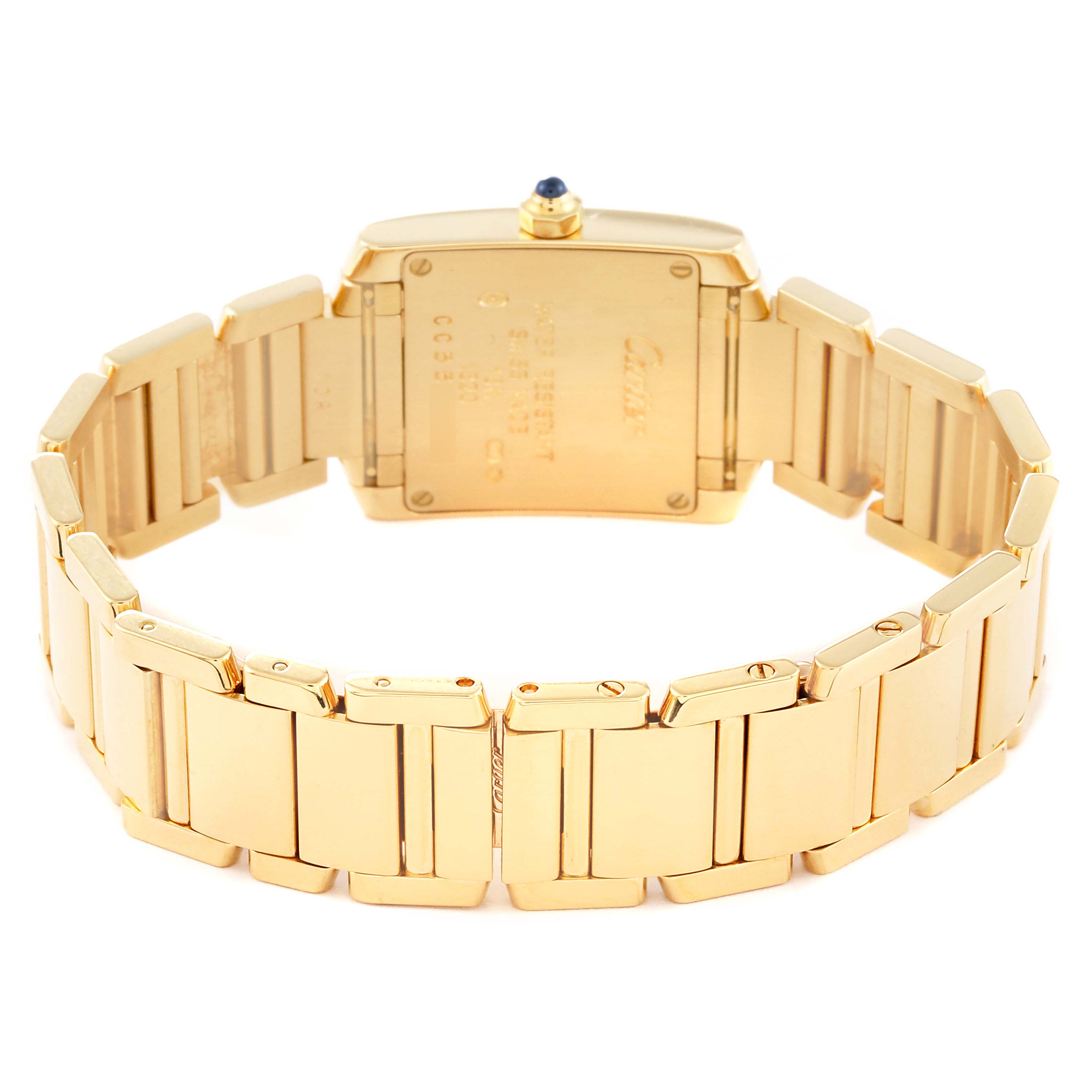 The image shows the back of a Cartier Tank Française watch and its gold bracelet from a slightly elevated angle.