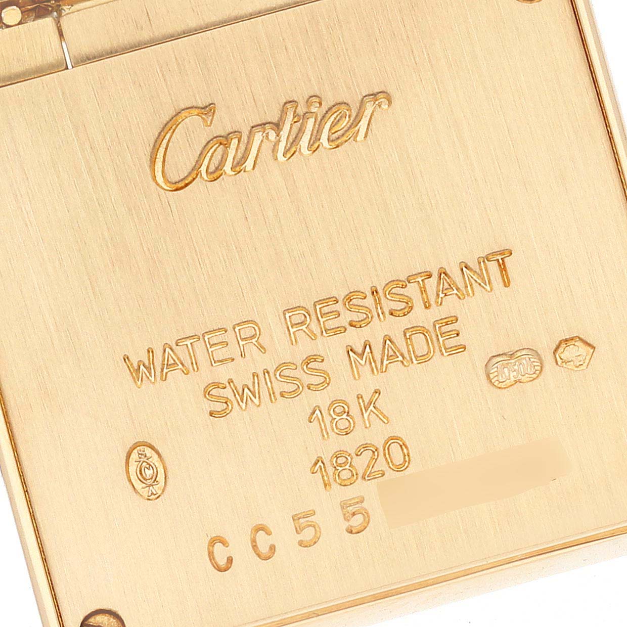 This image shows the back case of a Cartier Tank Francaise W50002N2 Women's Yellow Gold Silver Dial W50002N2 Women's Yellow Gold Silver Dial watch, featuring engravings of specifications.