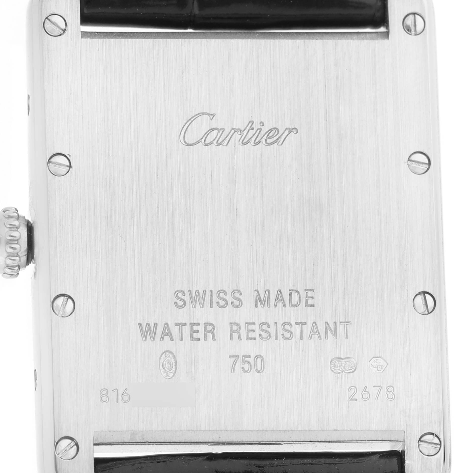 The image shows the back of a Cartier Tank Louis W1540956 Men's White Gold Silver Dial watch, highlighting the engraved details and Swiss Made markings.