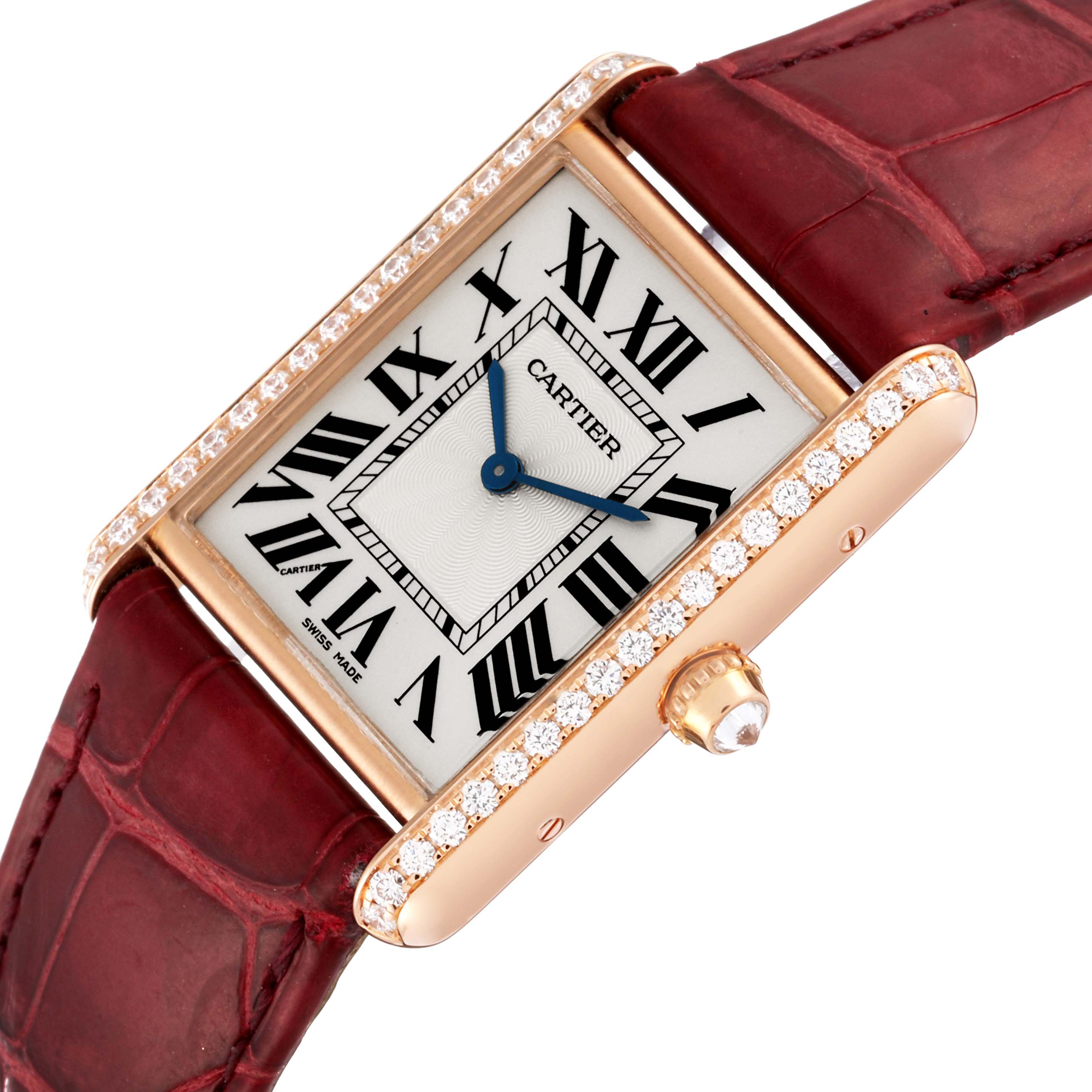 The Cartier Tank Louis WJTA0014 Women's Rose Gold Silver Dial WJTA0014 Women's Rose Gold Silver Dial watch is shown at an angle highlighting its face, crown, and part of its red leather strap.