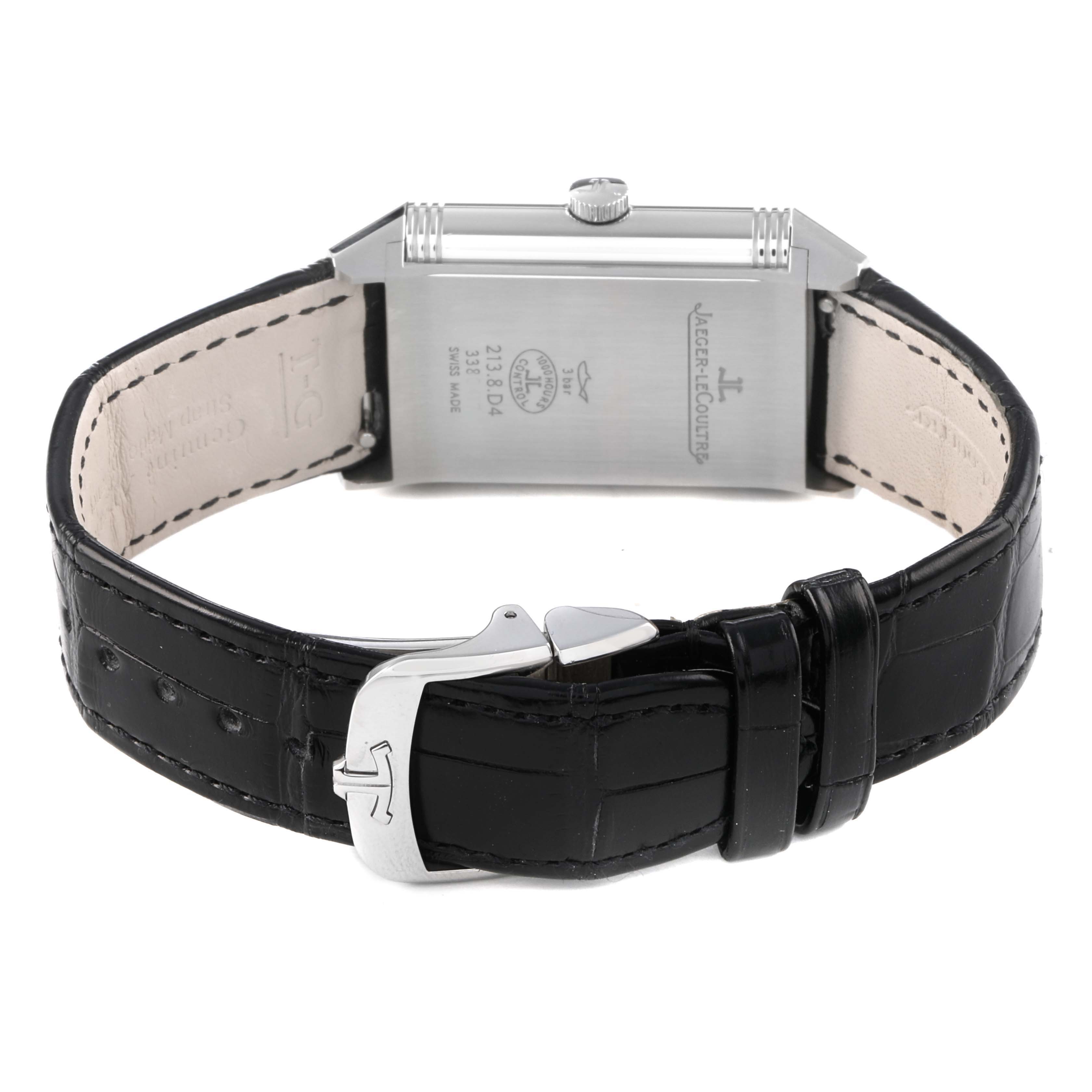 The image shows the back and clasp of a Jaeger-LeCoultre Reverso watch, highlighting the strap and buckle.