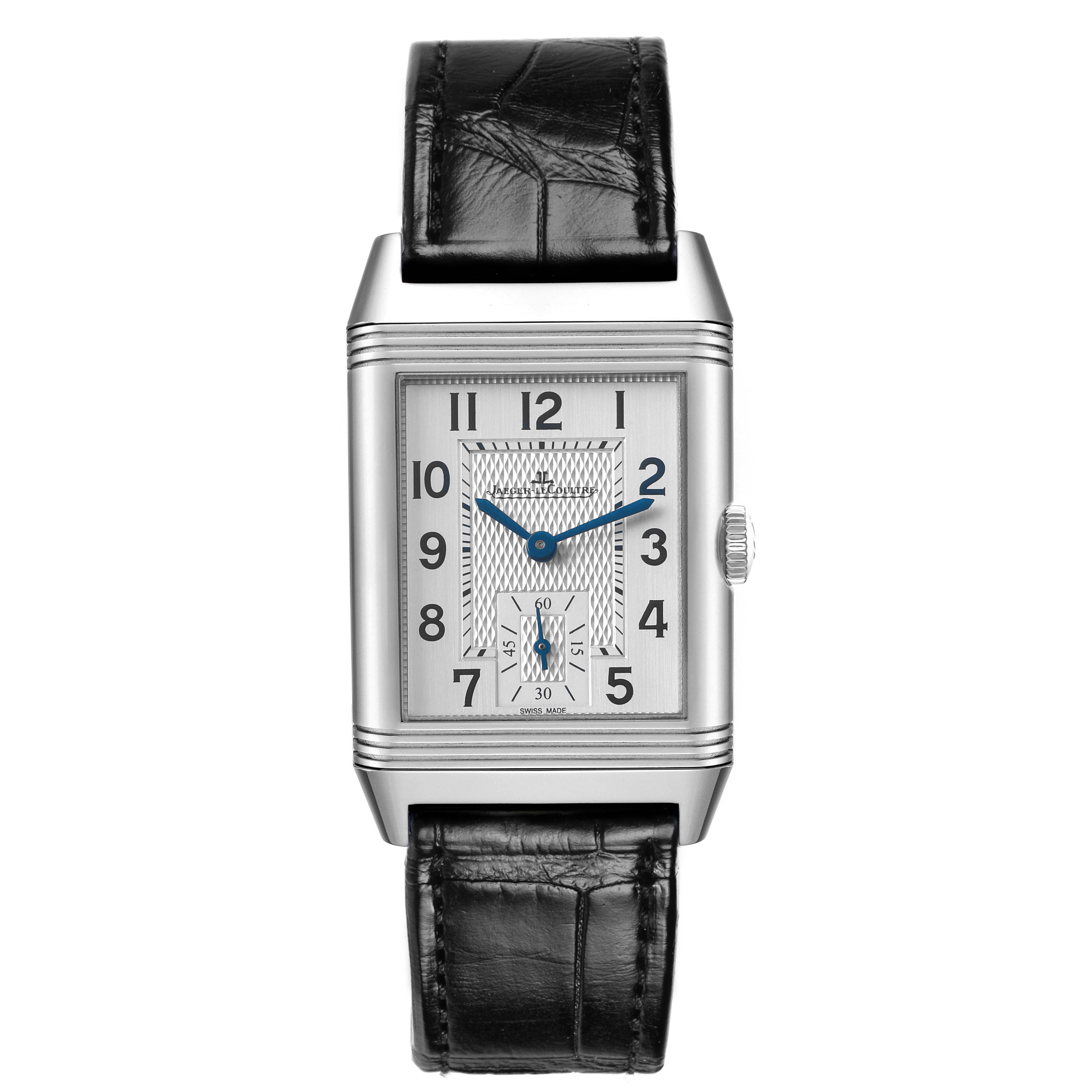 The Jaeger-LeCoultre Reverso watch is shown from the front, highlighting its rectangular dial and black leather strap.