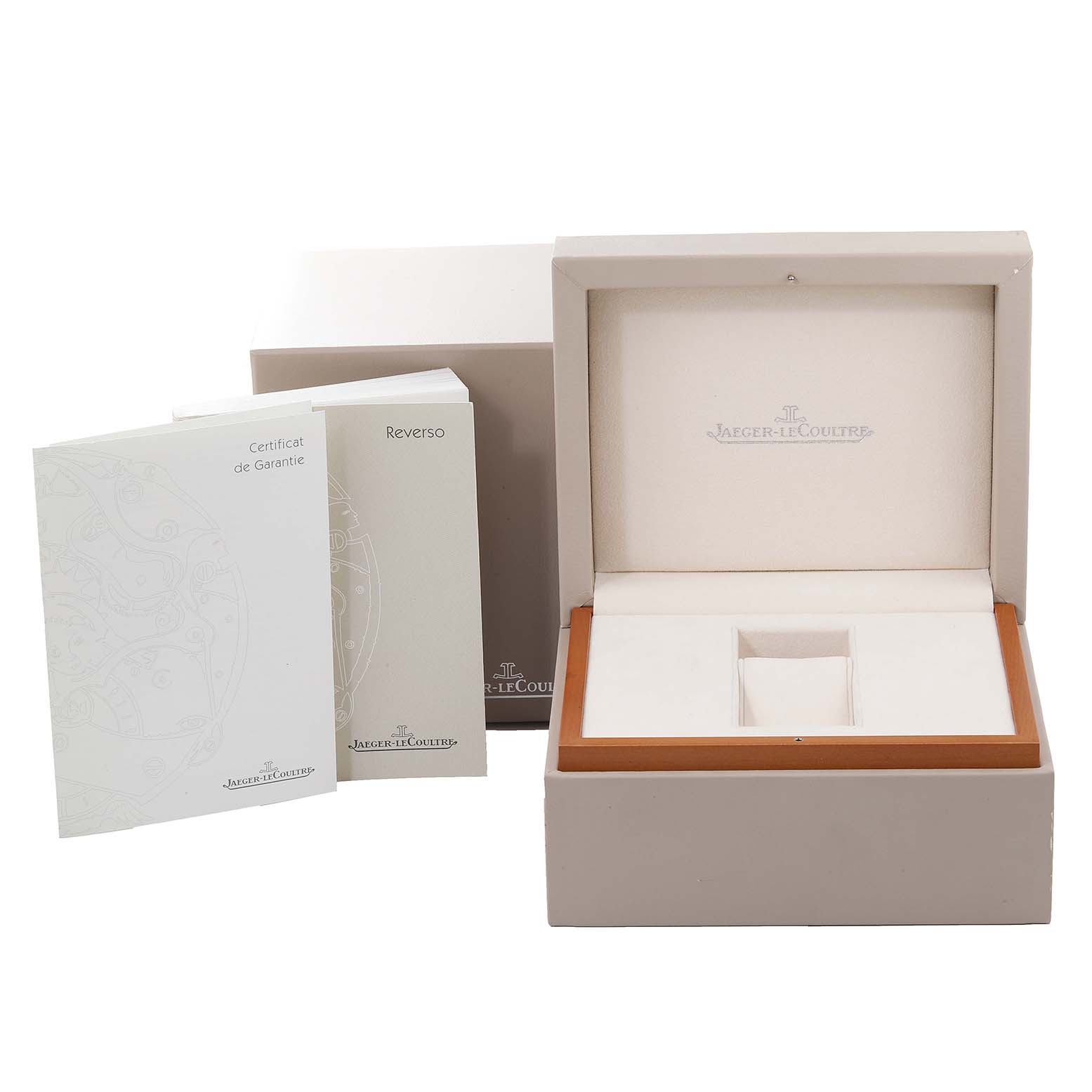 The image shows an open Jaeger LeCoultre Reverso Q3022420 Men's Rose Gold Silver Dial Q3022420 Men's Rose Gold Silver Dial watch box with guarantee and instruction booklets.