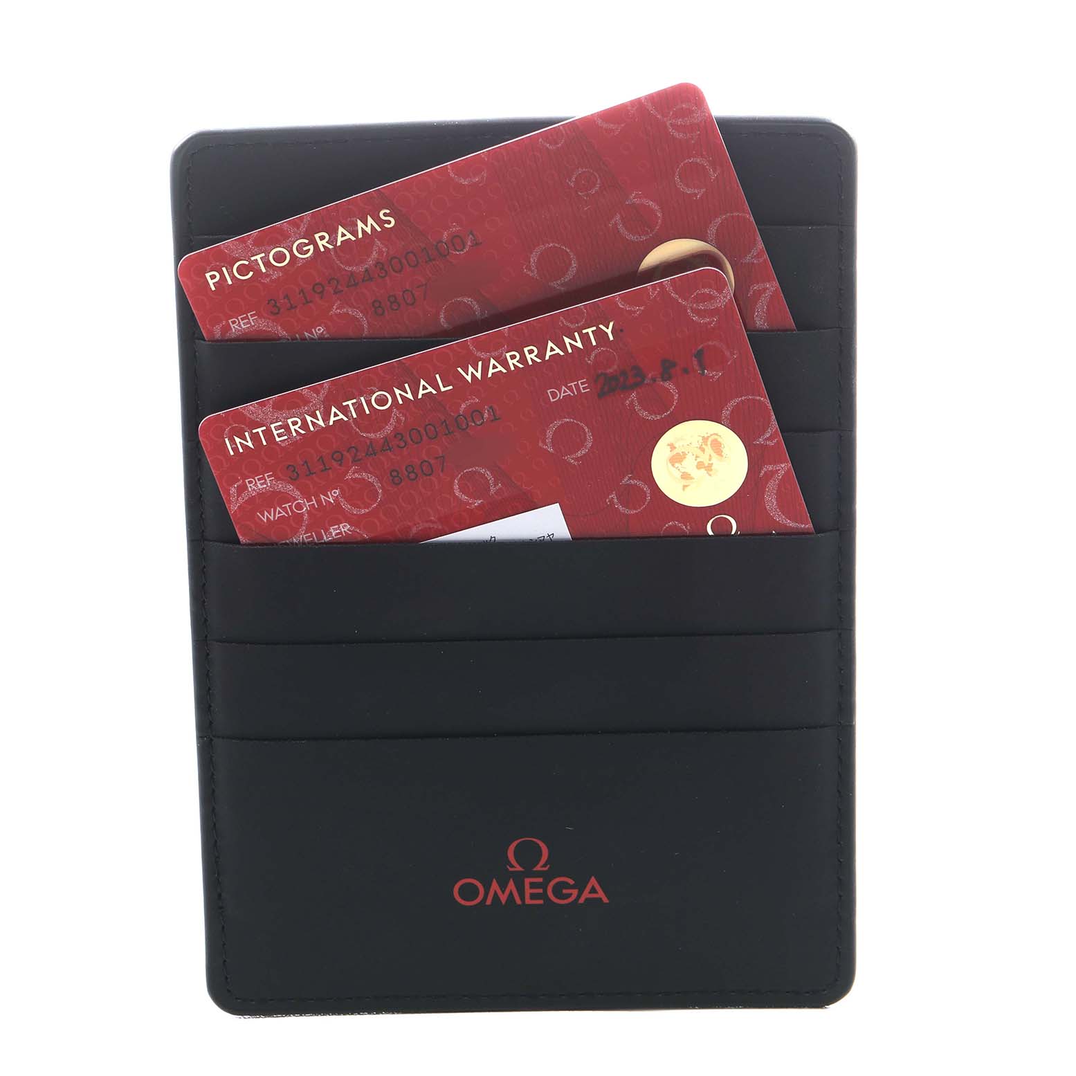 The image shows an Omega Speedmaster 311.92.44.30.01.001 Men's Ceramic Black Dial cardholder with Pictograms and International Warranty cards inserted.