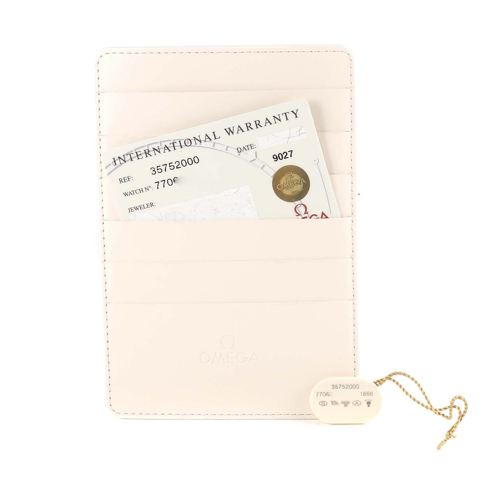 An Omega Speedmaster 3575.20.00 Men's Stainless Steel White Dial 3575.20.00 Men's Stainless Steel White Dial International Warranty card and a tag with serial numbers are shown in a light leather holder.