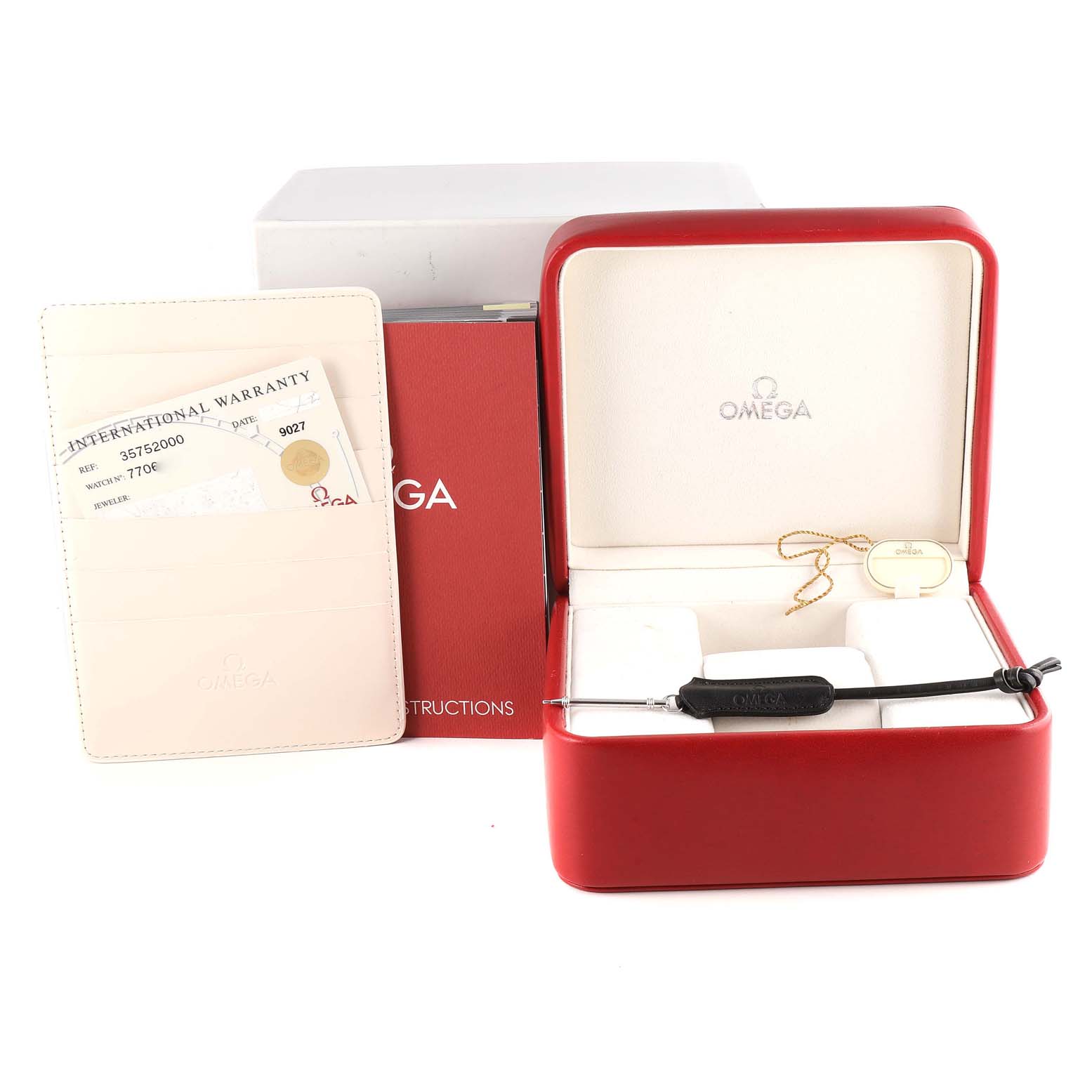 The image shows the packaging and accessories for an Omega Speedmaster 3575.20.00 Men's Stainless Steel White Dial 3575.20.00 Men's Stainless Steel White Dial, including the box, warranty card, and instruction manual.