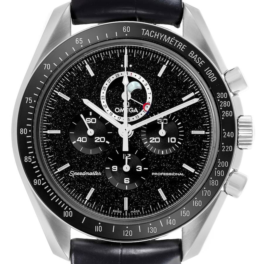 The Omega Speedmaster watch is shown from the front, highlighting its black dial, tachymeter bezel, and moon phase subdial.