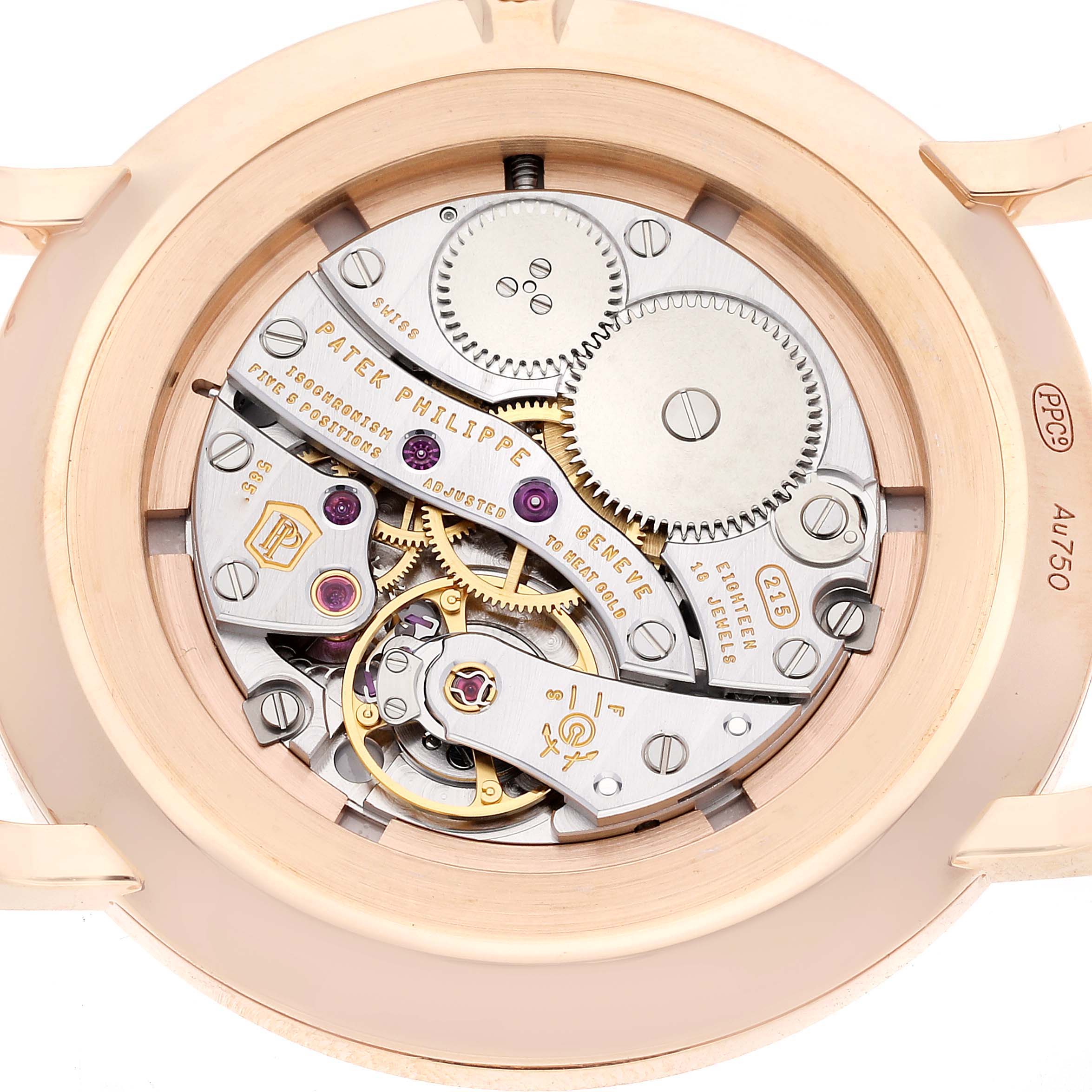 The image shows the intricate movement mechanism of a Patek Philippe Calatrava 5116R-001 Men
s Rose Gold White Dial 5116R-001 Men
s Rose Gold White Dial watch from a rear case view.