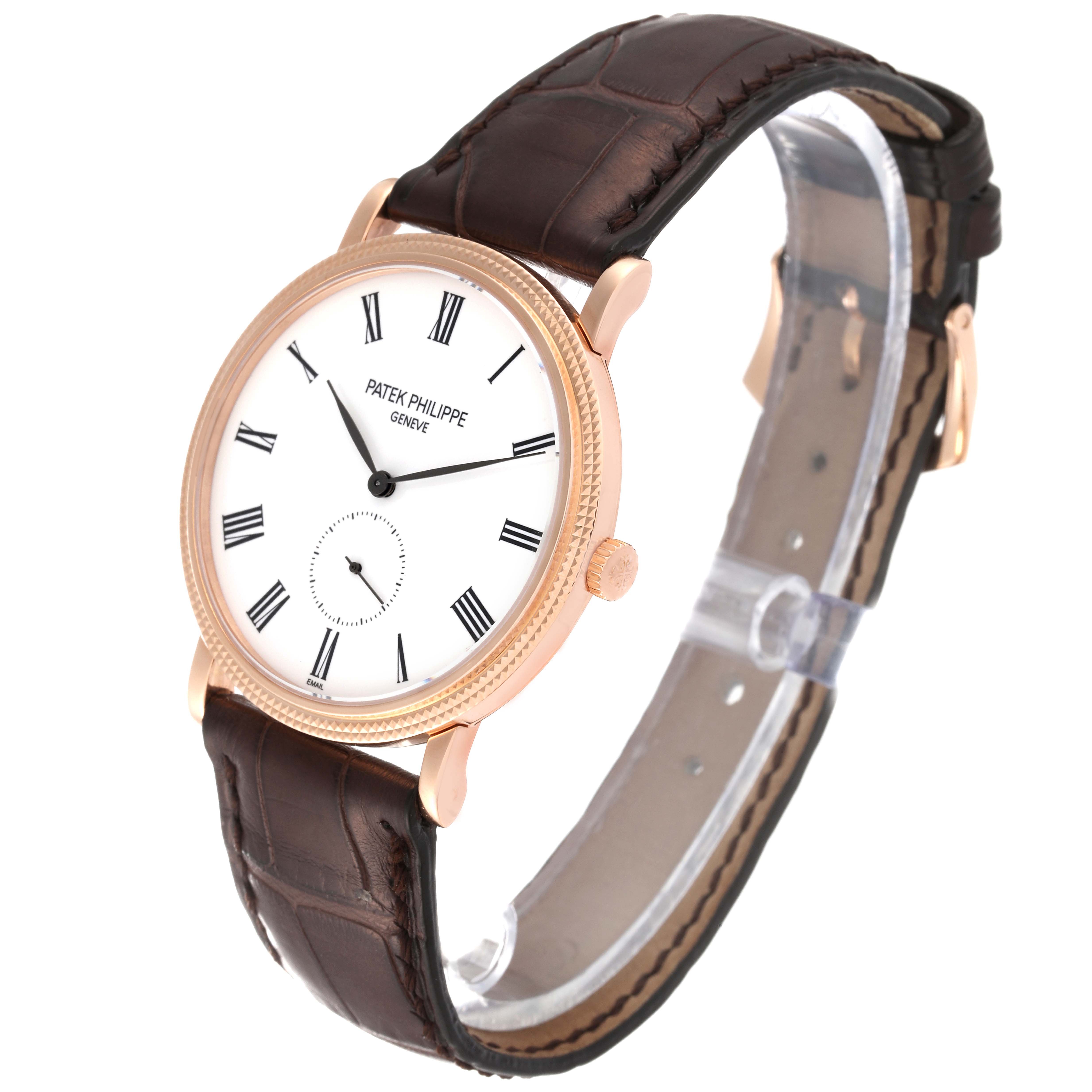 This image shows a Patek Philippe Calatrava 5116R-001 Men
s Rose Gold White Dial 5116R-001 Men
s Rose Gold White Dial watch at a three-quarter angle, highlighting the face, case, and leather strap.