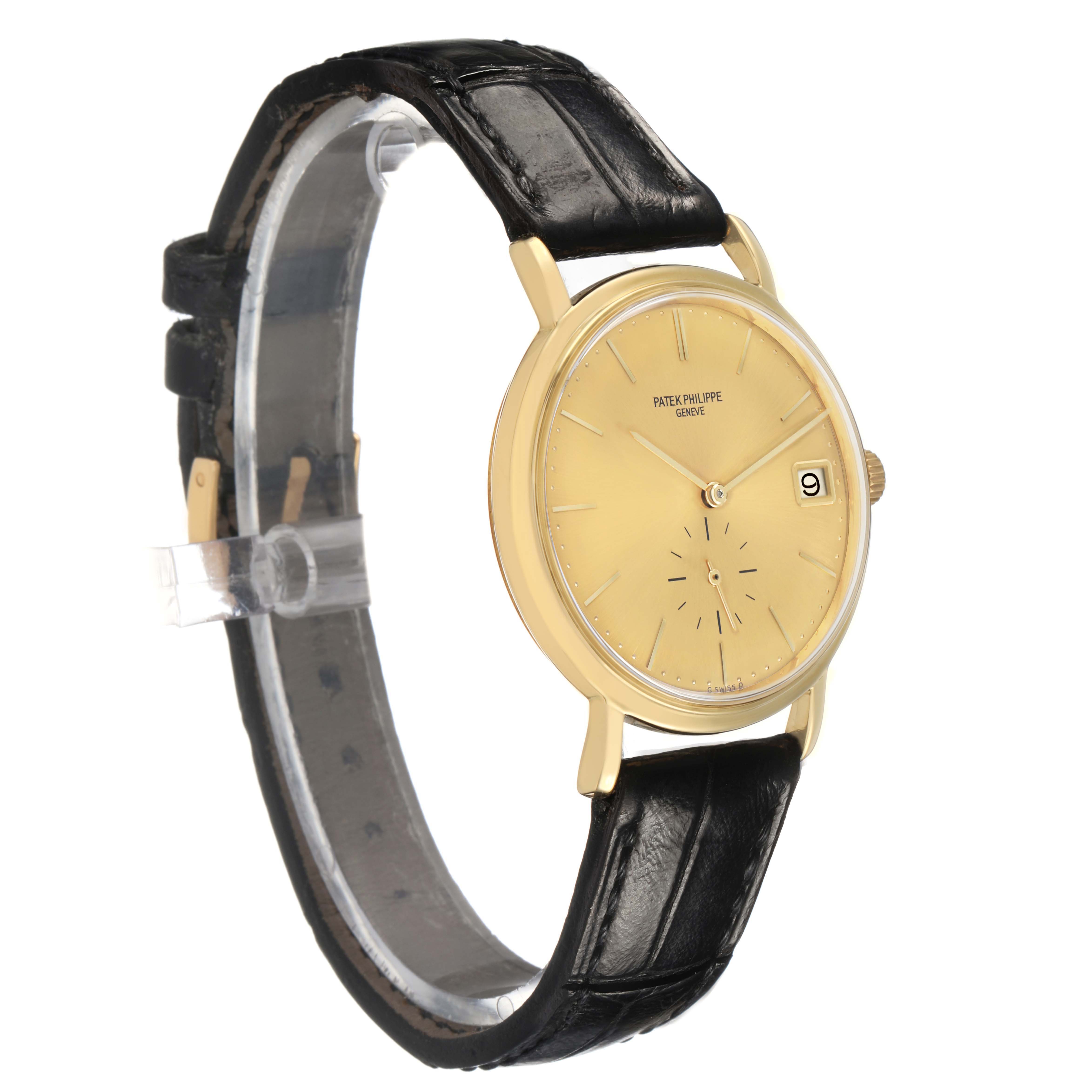 The Patek Philippe Calatrava 3445 Men's Yellow Gold Champagne Dial watch is shown at a slight angle, displaying its golden dial, date window, and black leather strap.