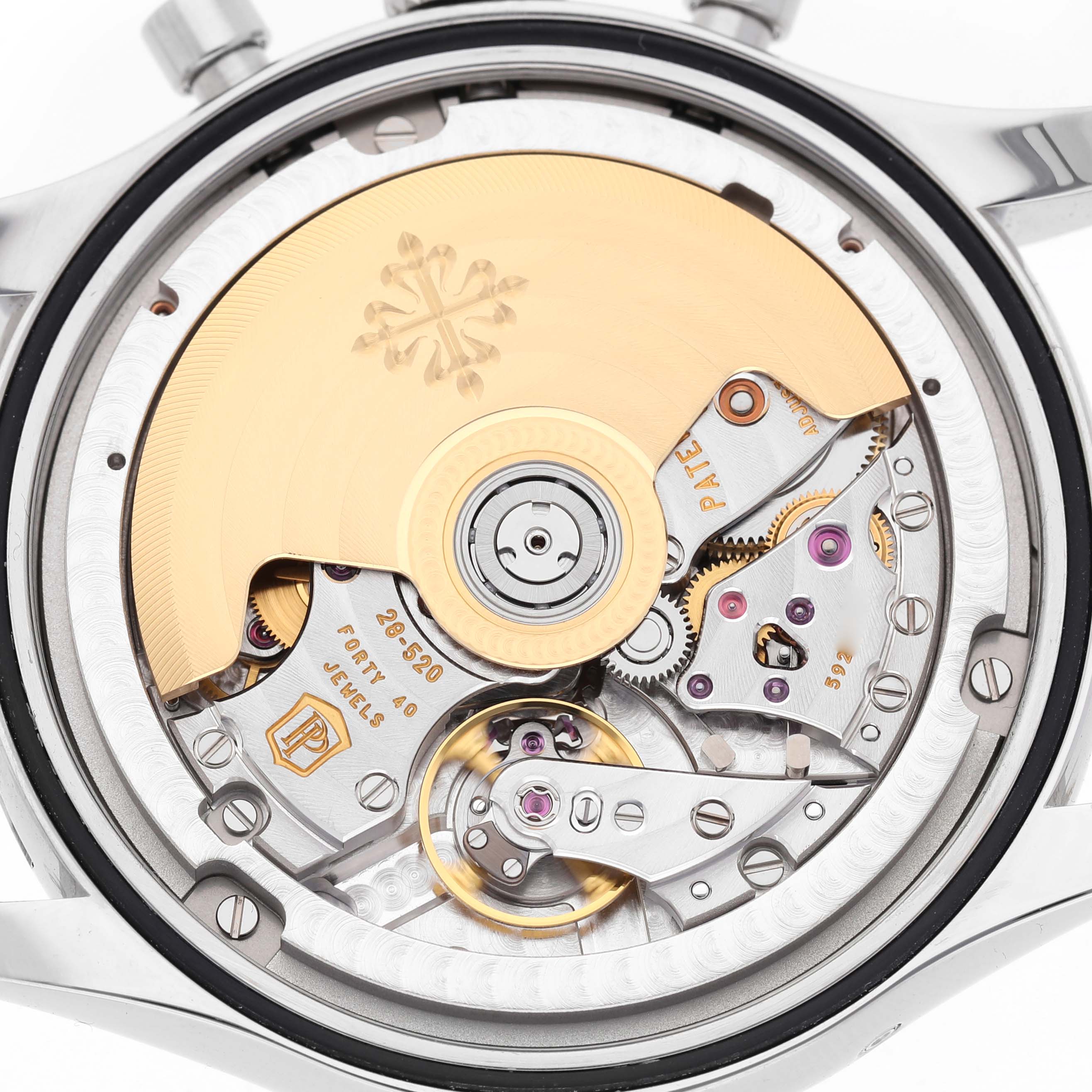 The image shows a Patek Philippe Complications 5960/1A-001 Men's Stainless Steel White Dial model from a rear angle, highlighting the intricate movement and rotor.