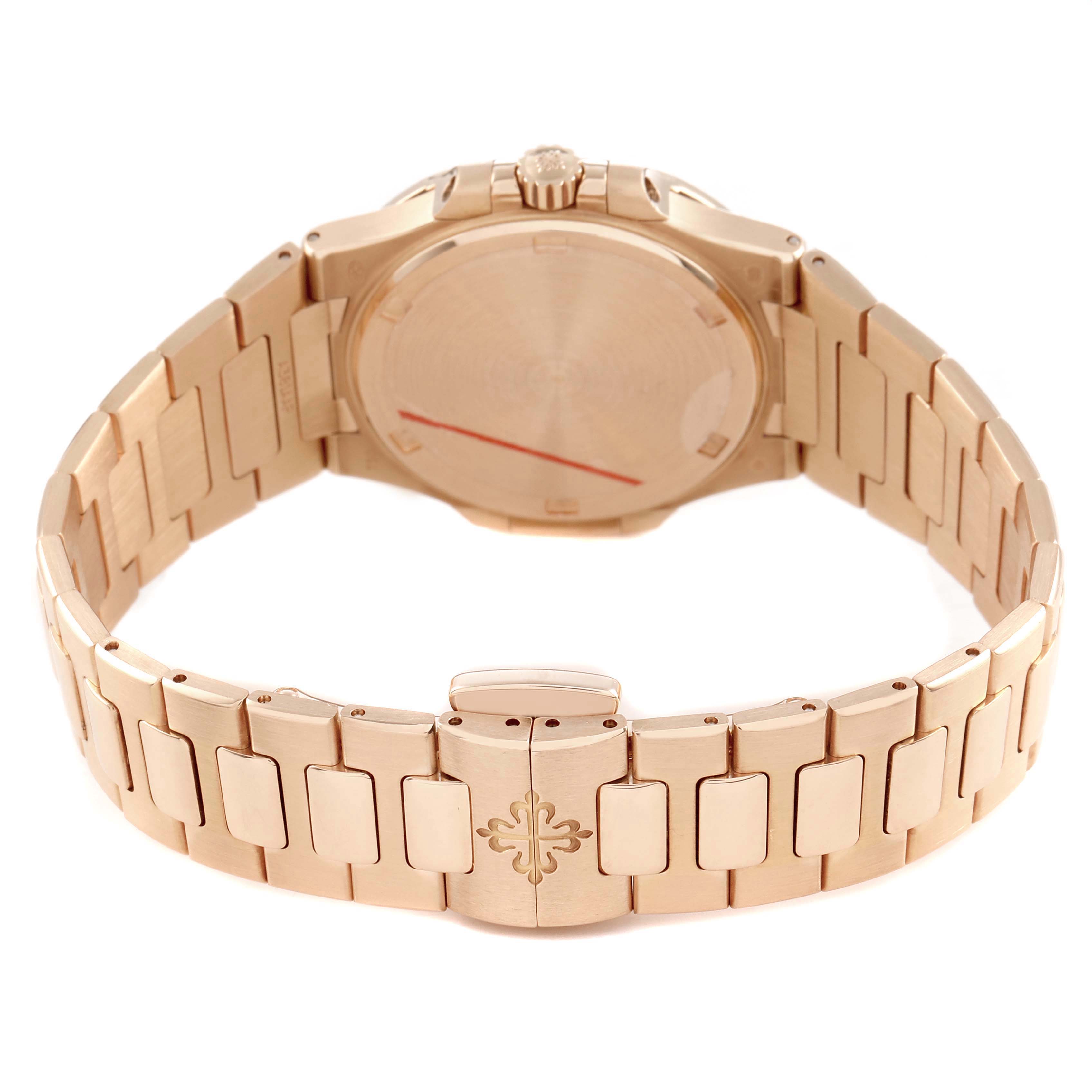 The image shows the back and bracelet of a Patek Philippe Nautilus 7010R Women's Rose Gold Silver Dial, highlighting the clasp and crown.