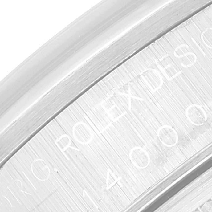 This close-up image shows the engraved text on the edge of the Rolex Air-King 14000 Men's Stainless Steel Blue Dial 14000 Men's Stainless Steel Blue Dial watch case.
