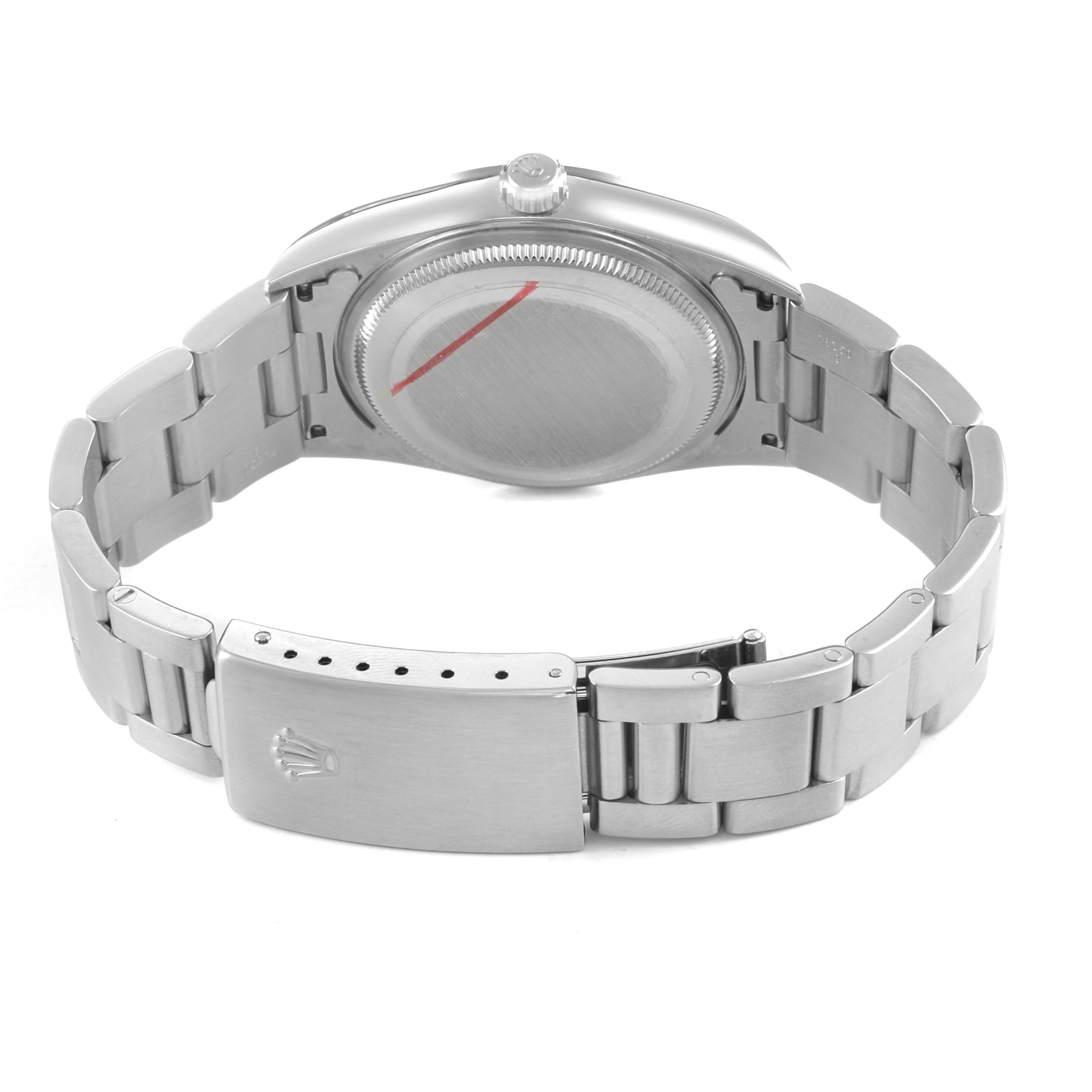 The image shows the Rolex Air-King 14000M Men's Stainless Steel Silver Dial watch from the back, displaying its case, crown, and bracelet with clasp.